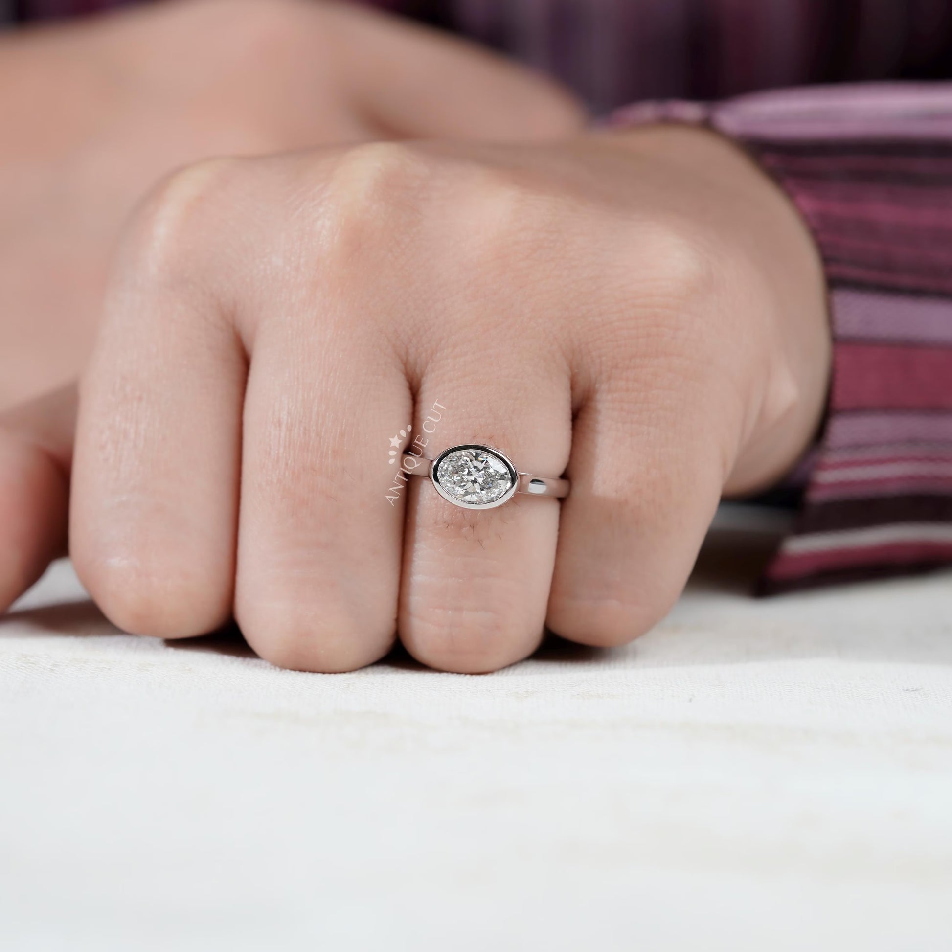 East west oval diamond ring with halo design