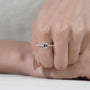 Classic emerald diamond ring with sparkling pave band
