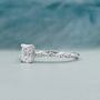 White gold emerald diamond engagement ring with pave diamonds
