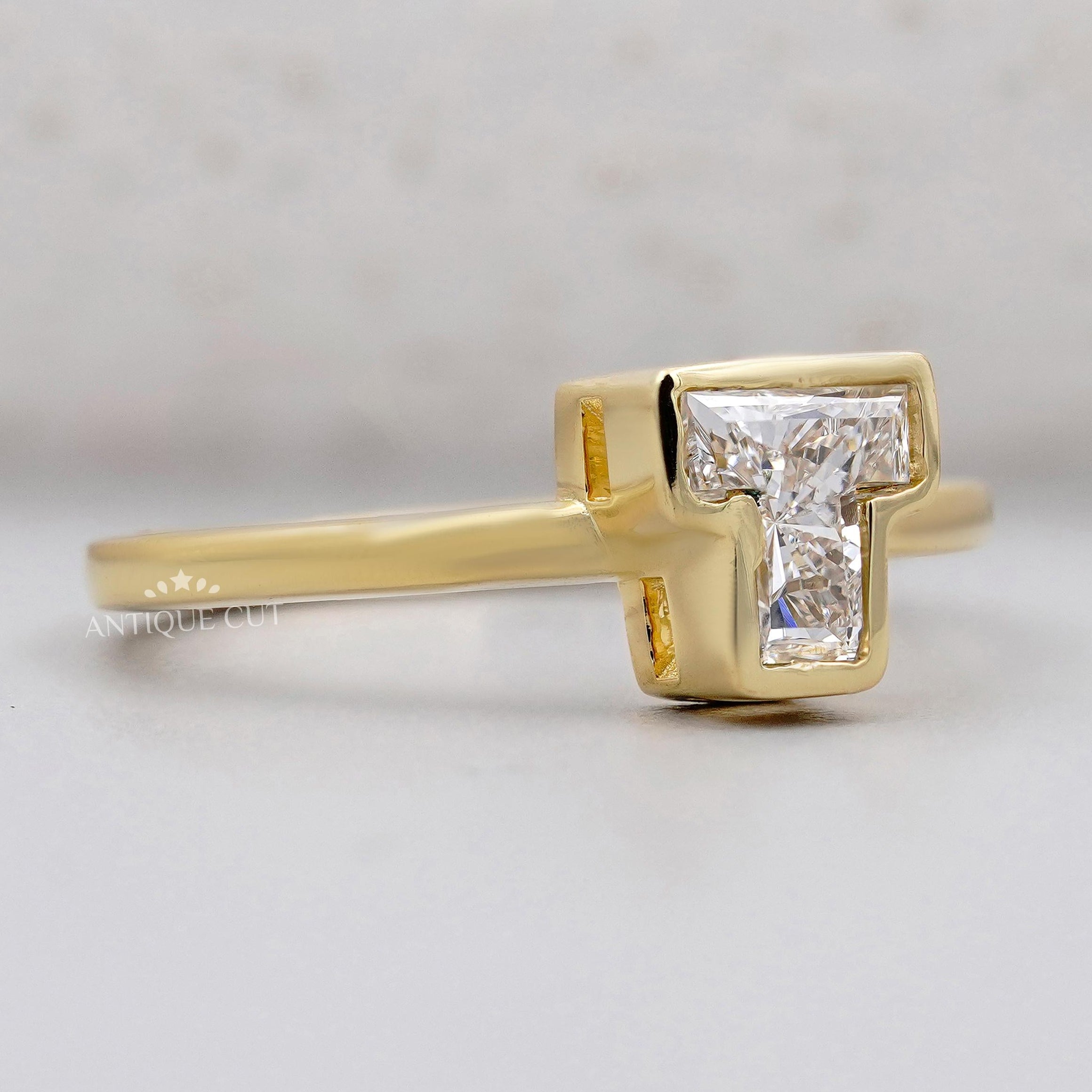 Yellow gold T initial diamond ring bezel set