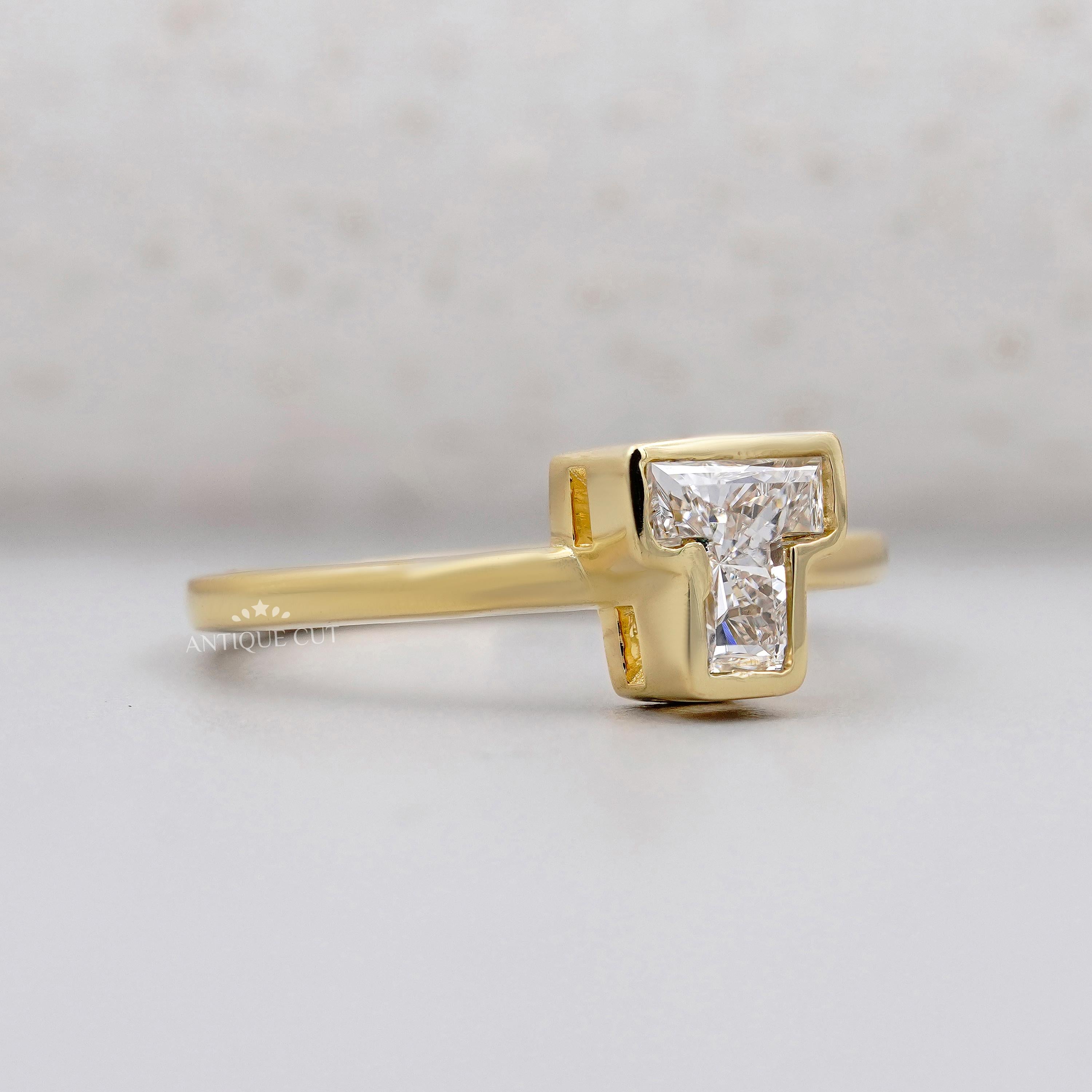 Yellow gold T initial diamond ring bezel set