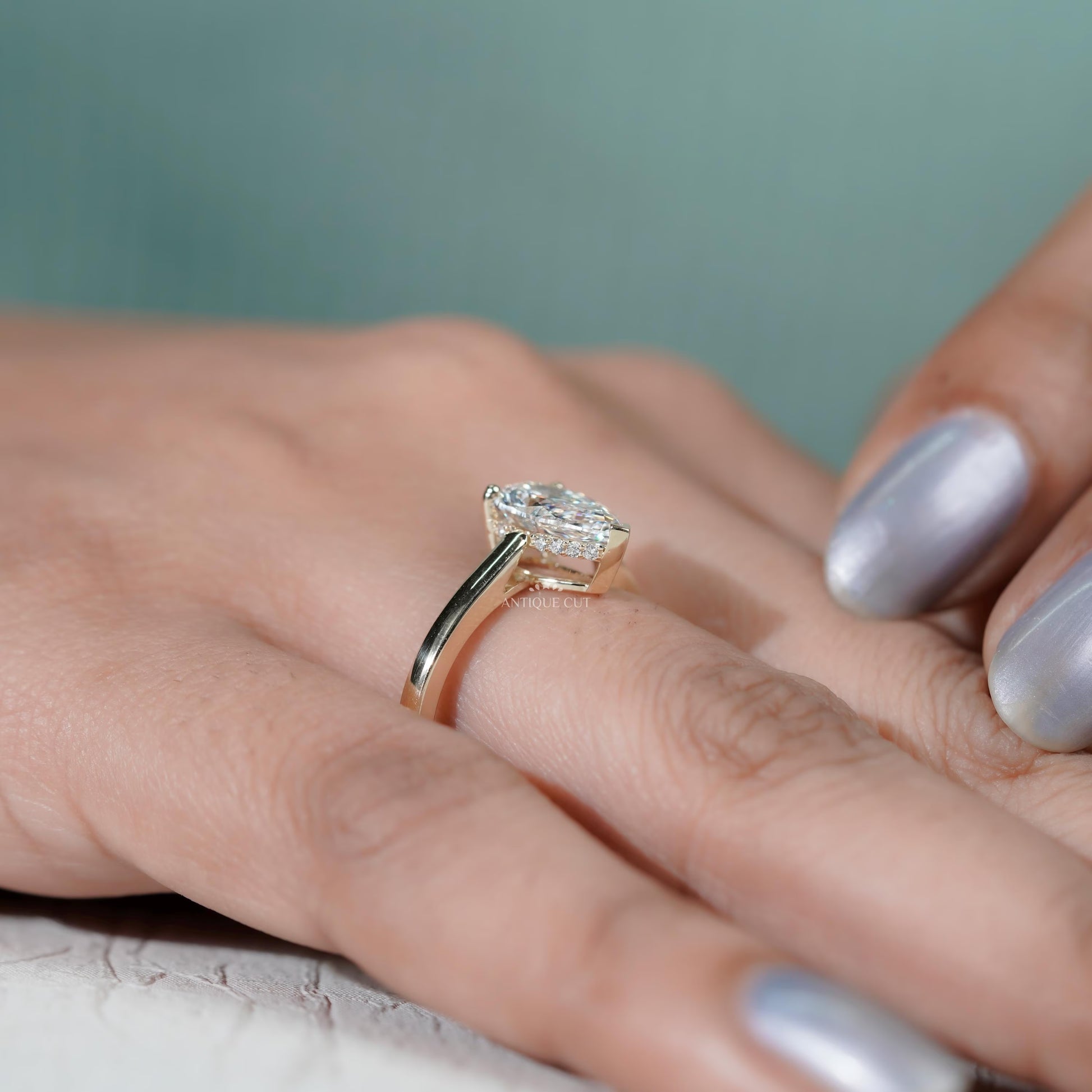 Close-up of hidden halo under pear diamond