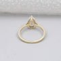 Hidden halo pear shape diamond ring close-up