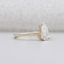 Yellow gold pear engagement ring side view