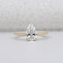 Pear shape engagement ring in yellow gold