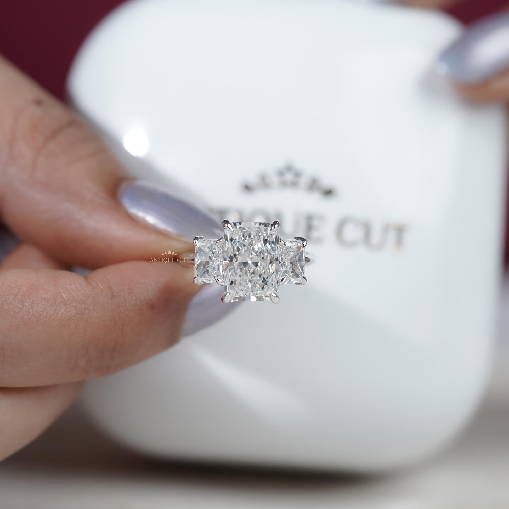 Radiant diamond ring with side stones