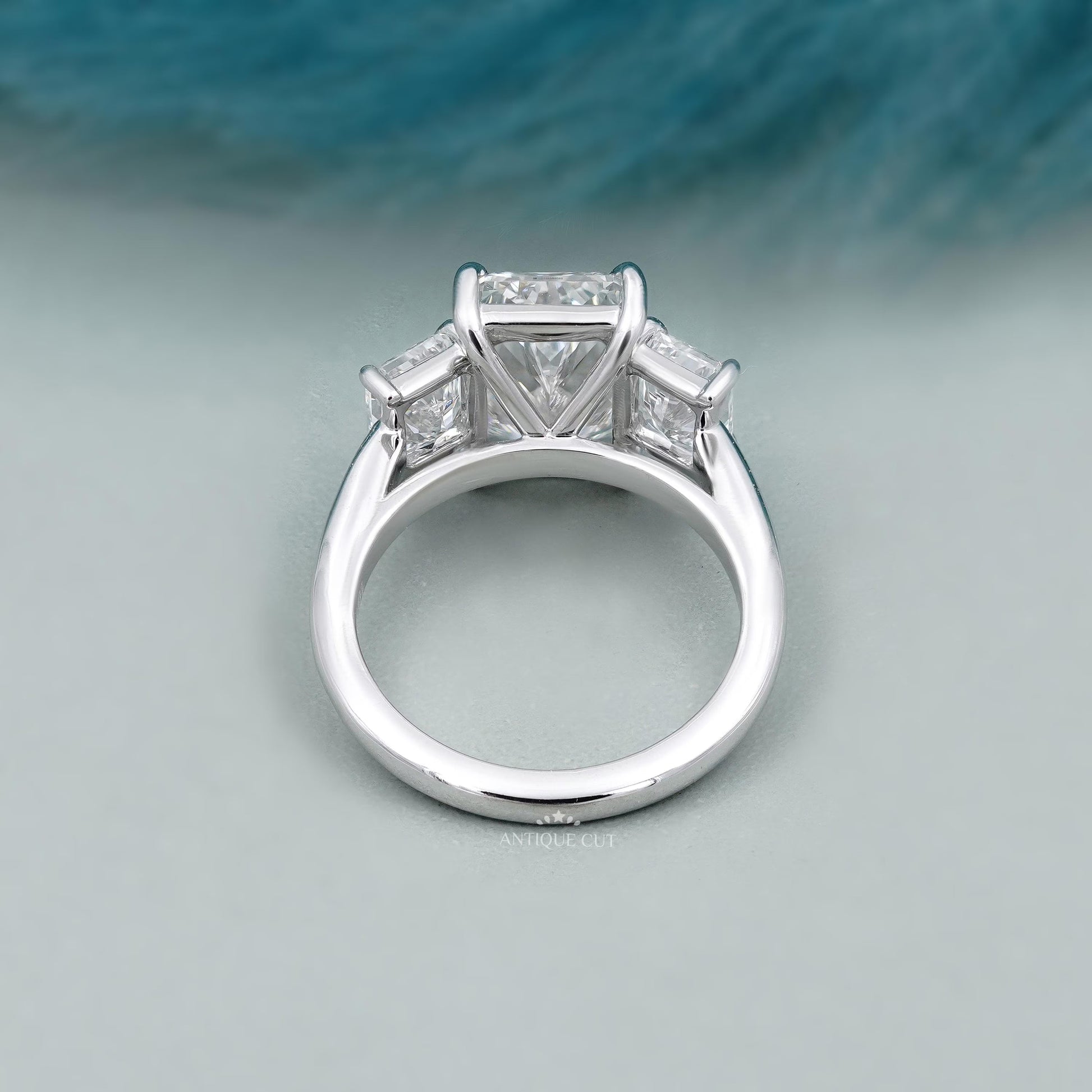 Three stone engagement ring radiant center diamond
