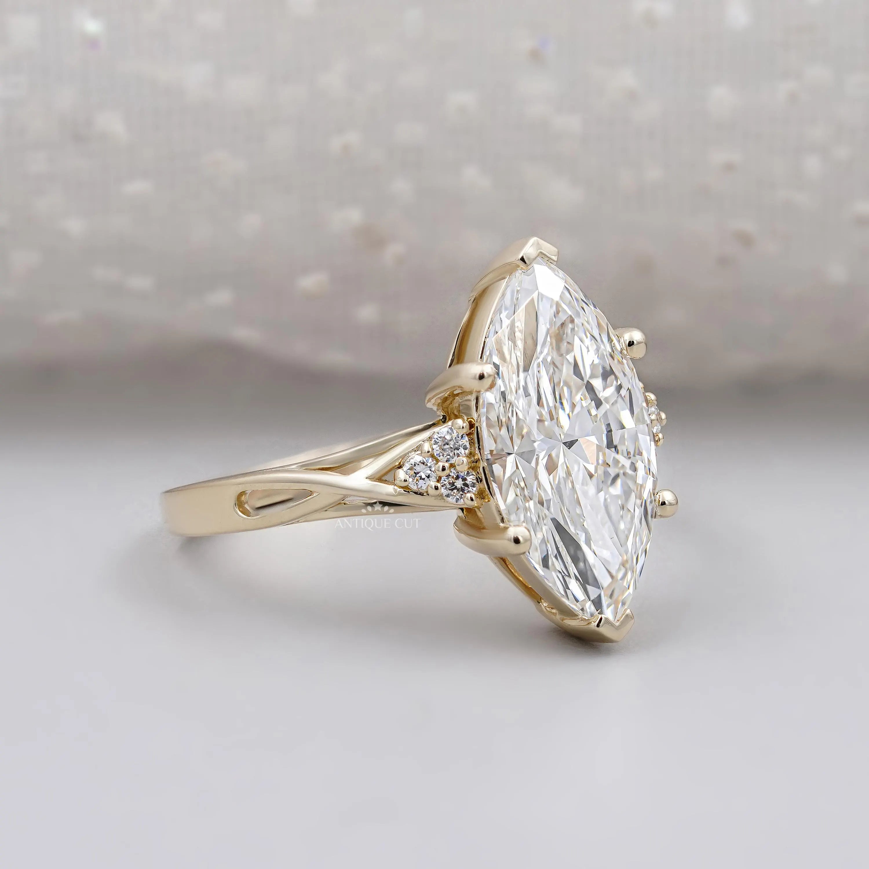 Marquise cut diamond engagement ring with vintage style yellow gold setting