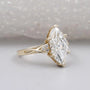 Marquise cut diamond engagement ring with vintage style yellow gold setting
