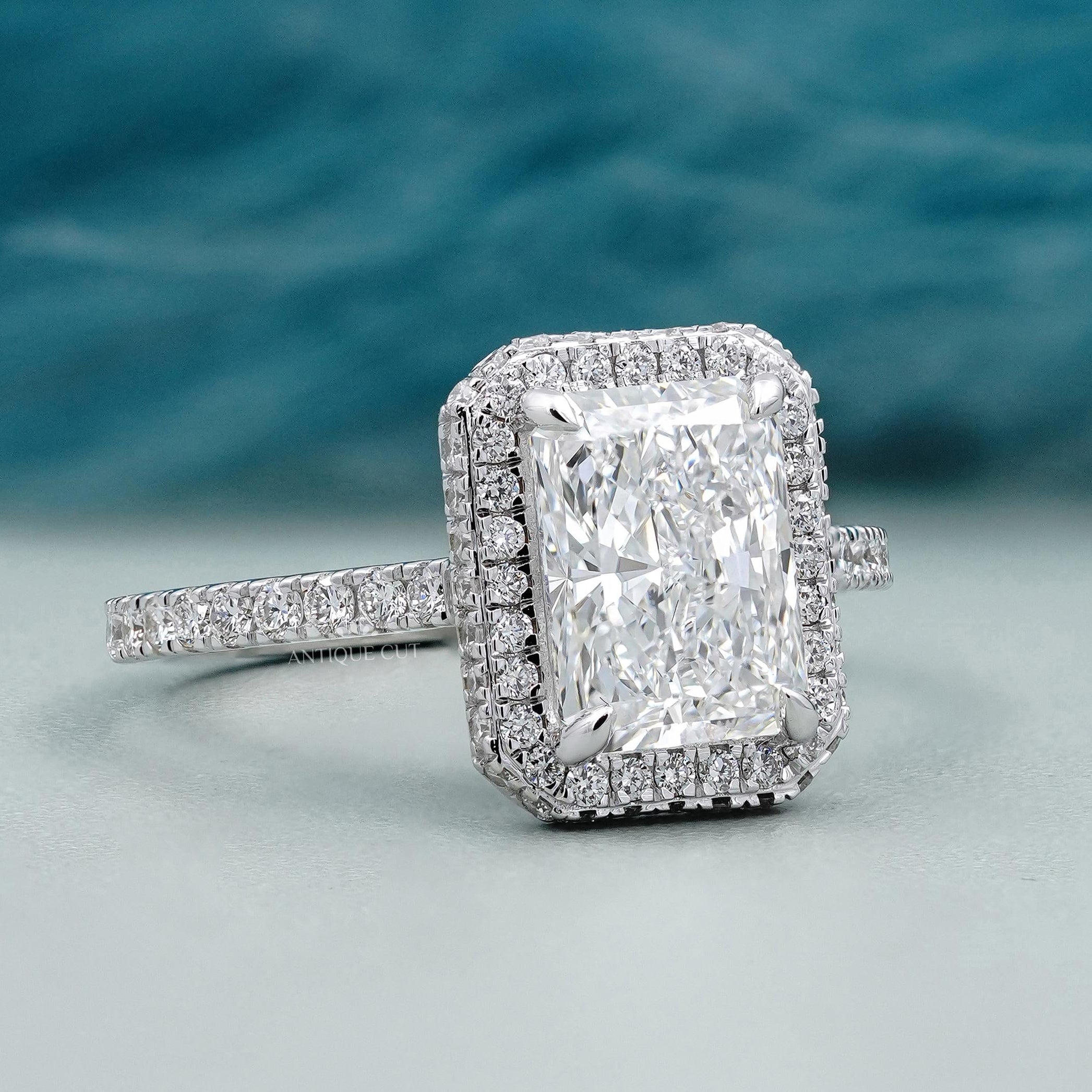 Hidden halo diamond ring with pave band