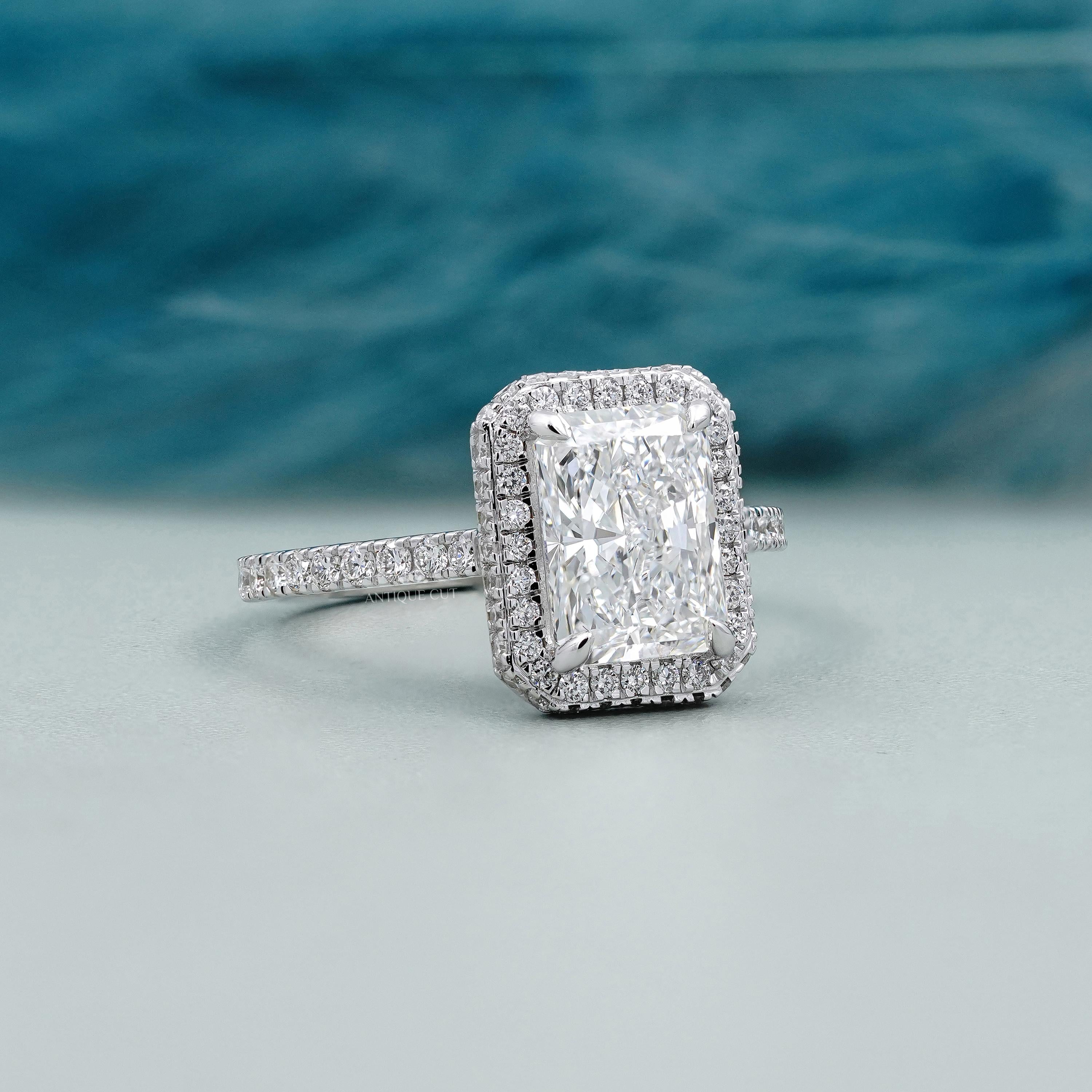 Hidden halo diamond ring with pave band