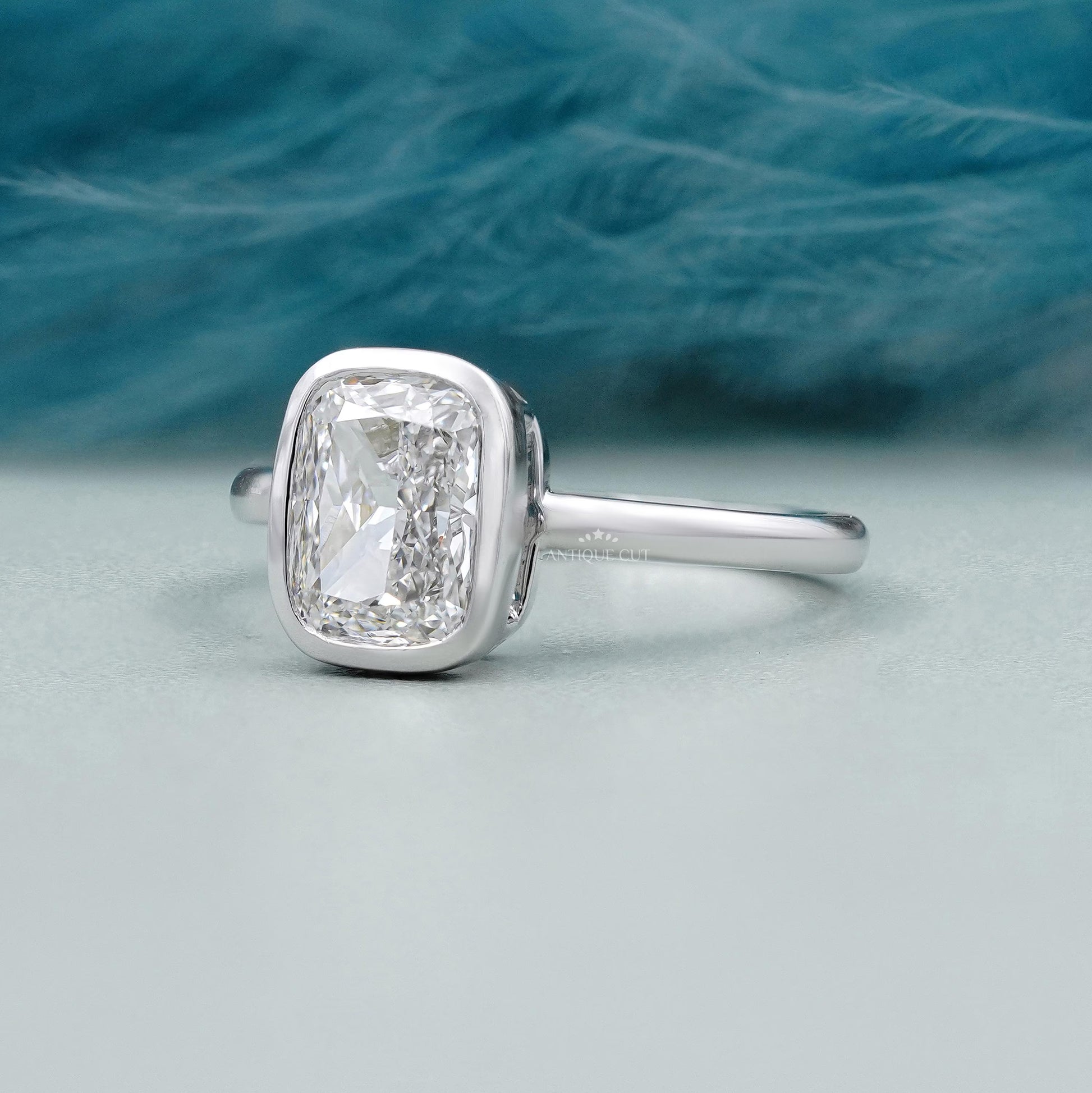 White gold bezel set engagement ring
