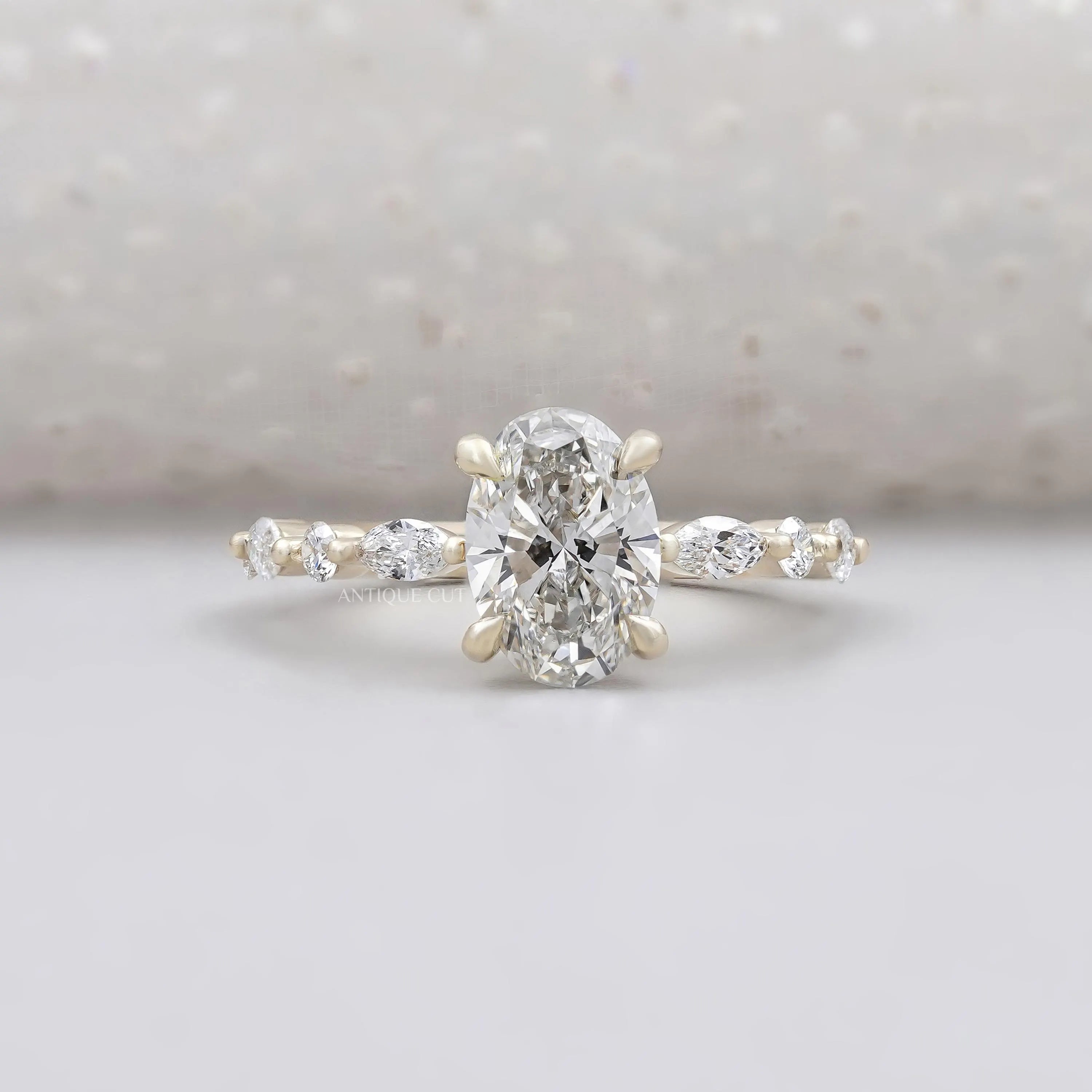 Oval cut wedding ring with marquise side stones