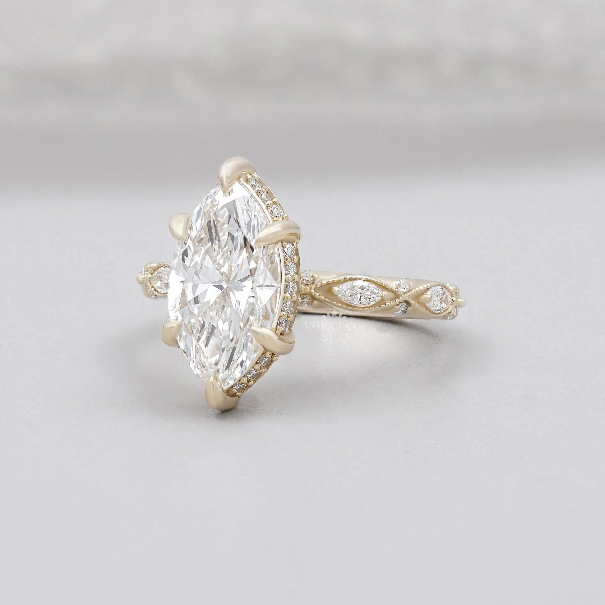 Yellow gold marquise diamond bridal ring with vintage style setting