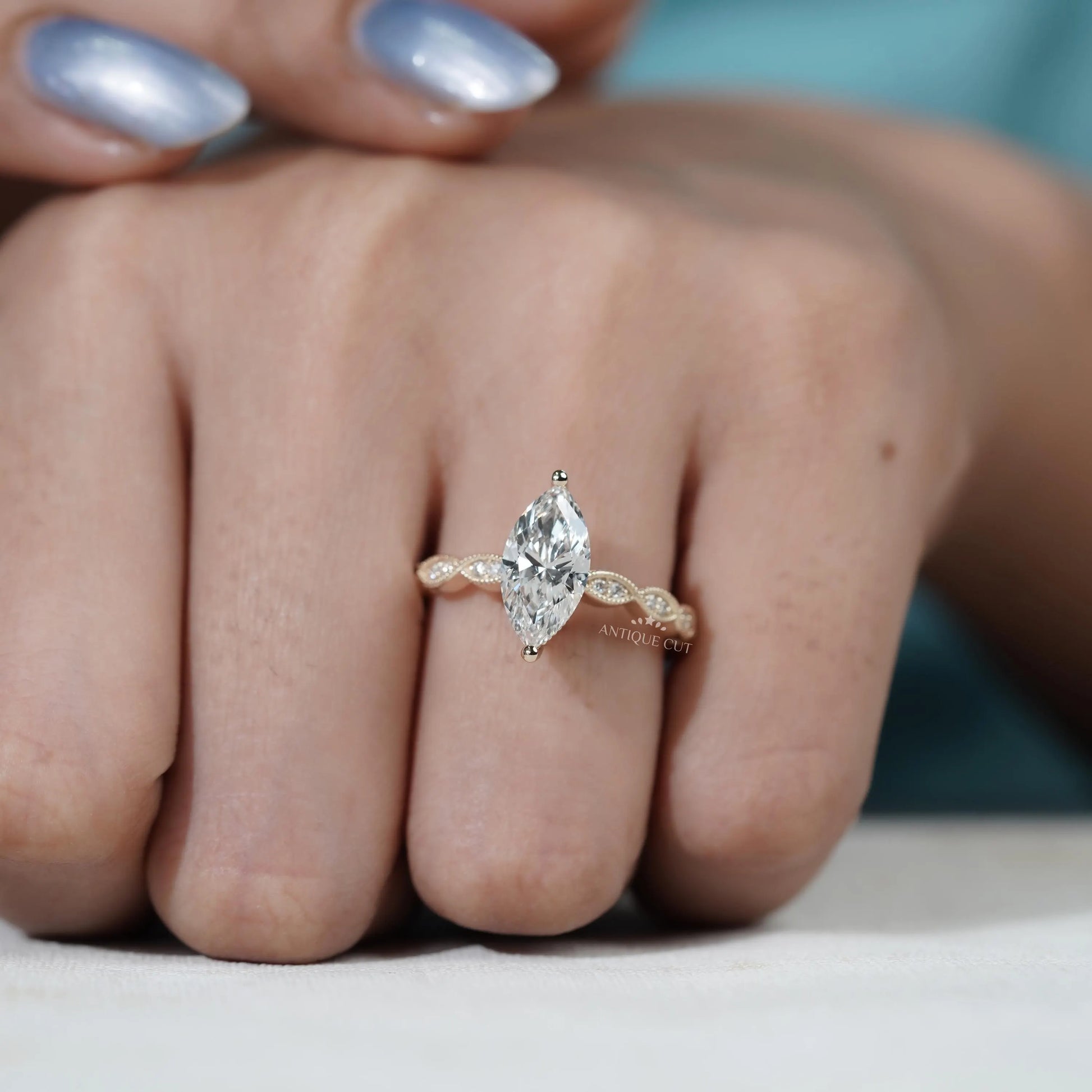 Unique vintage style marquise diamond engagement ring