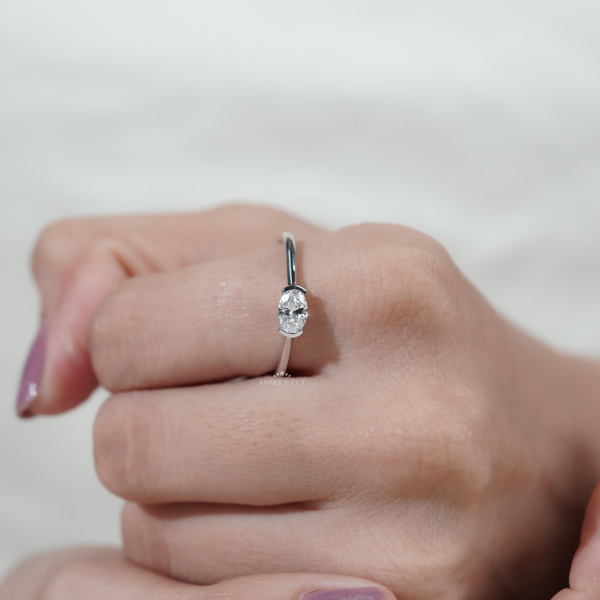 Modern horizontal oval diamond engagement ring