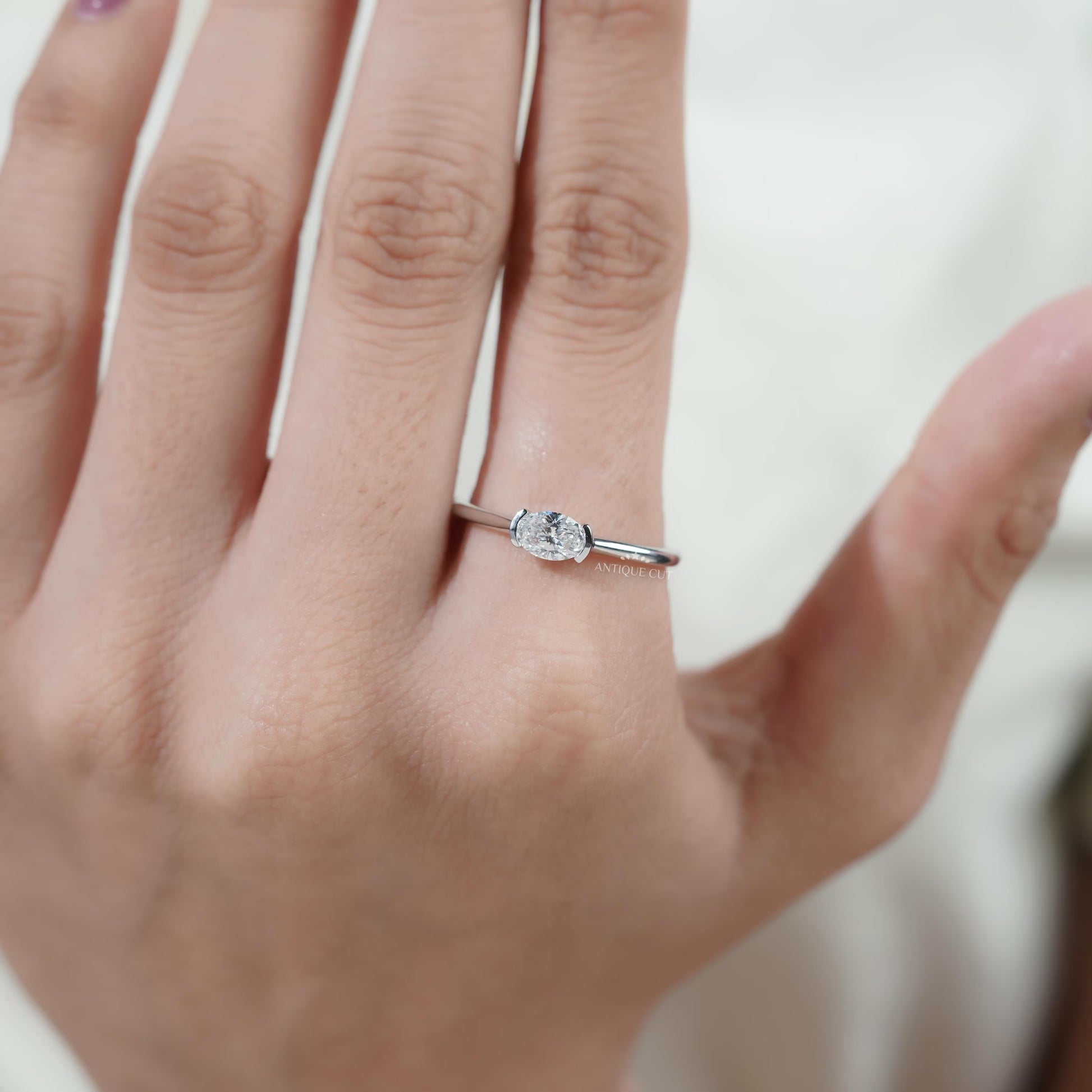 Minimal white gold oval diamond solitaire ring