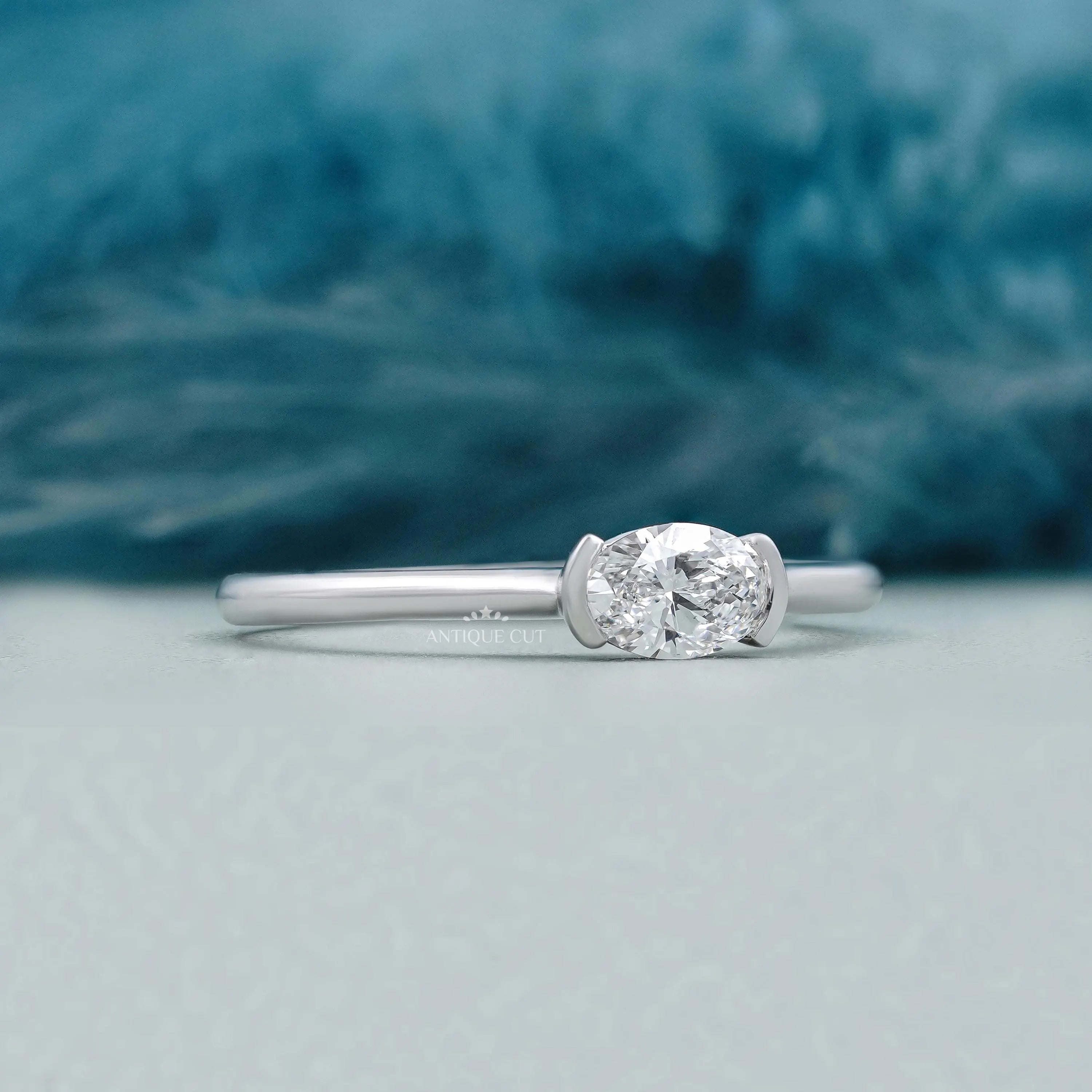 East West oval diamond engagement ring with white gold setting