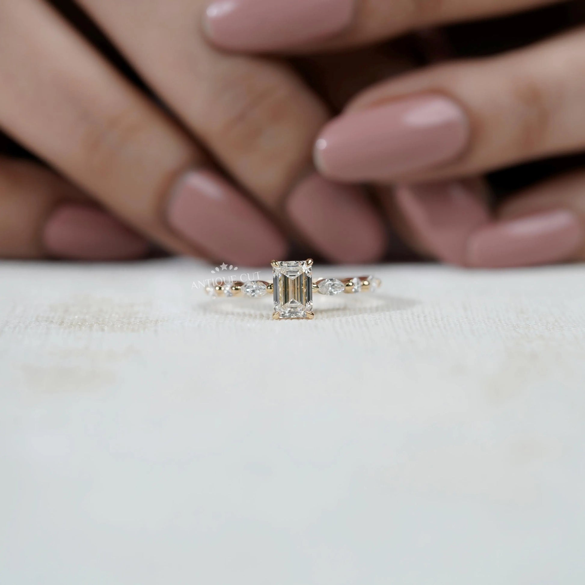 Luxury emerald cut engagement ring close-up yellow gold
