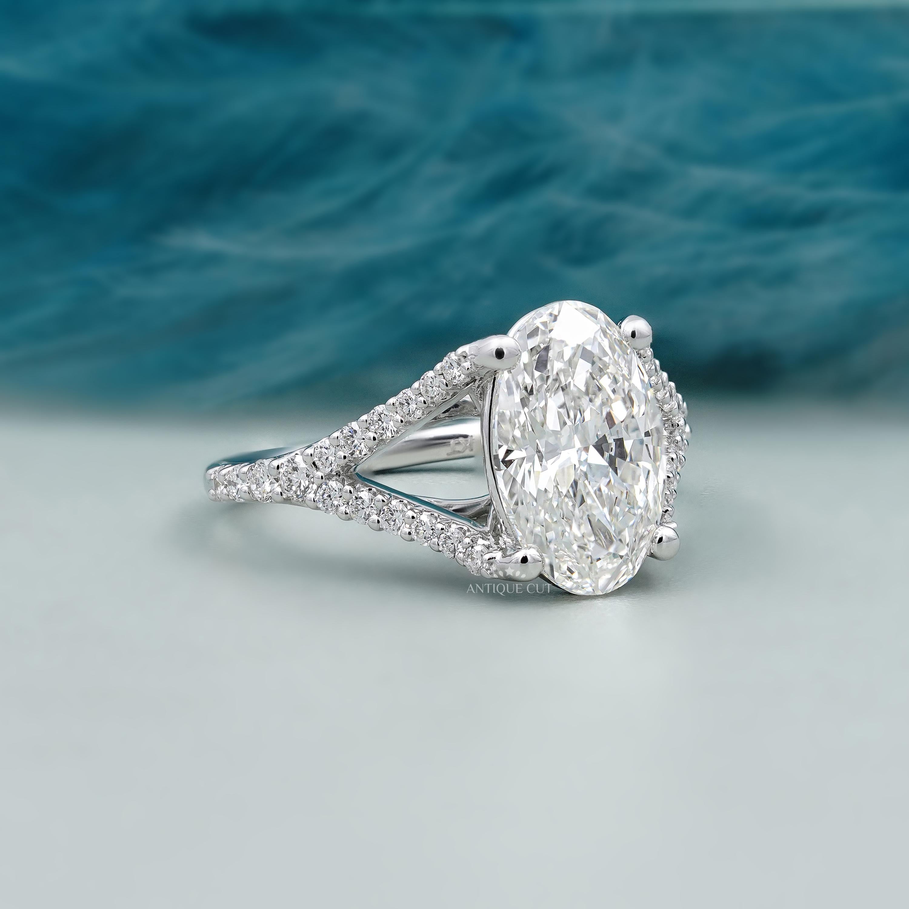 Oval cut diamond split shank engagement ring with hidden halo setting