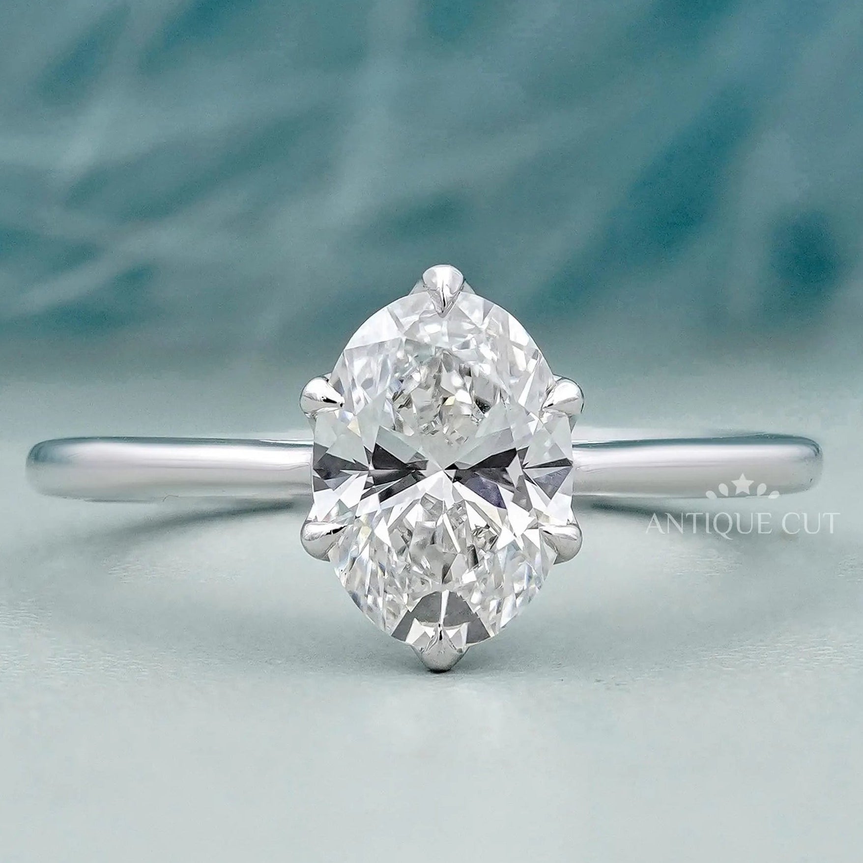 Oval solitaire engagement ring in white gold