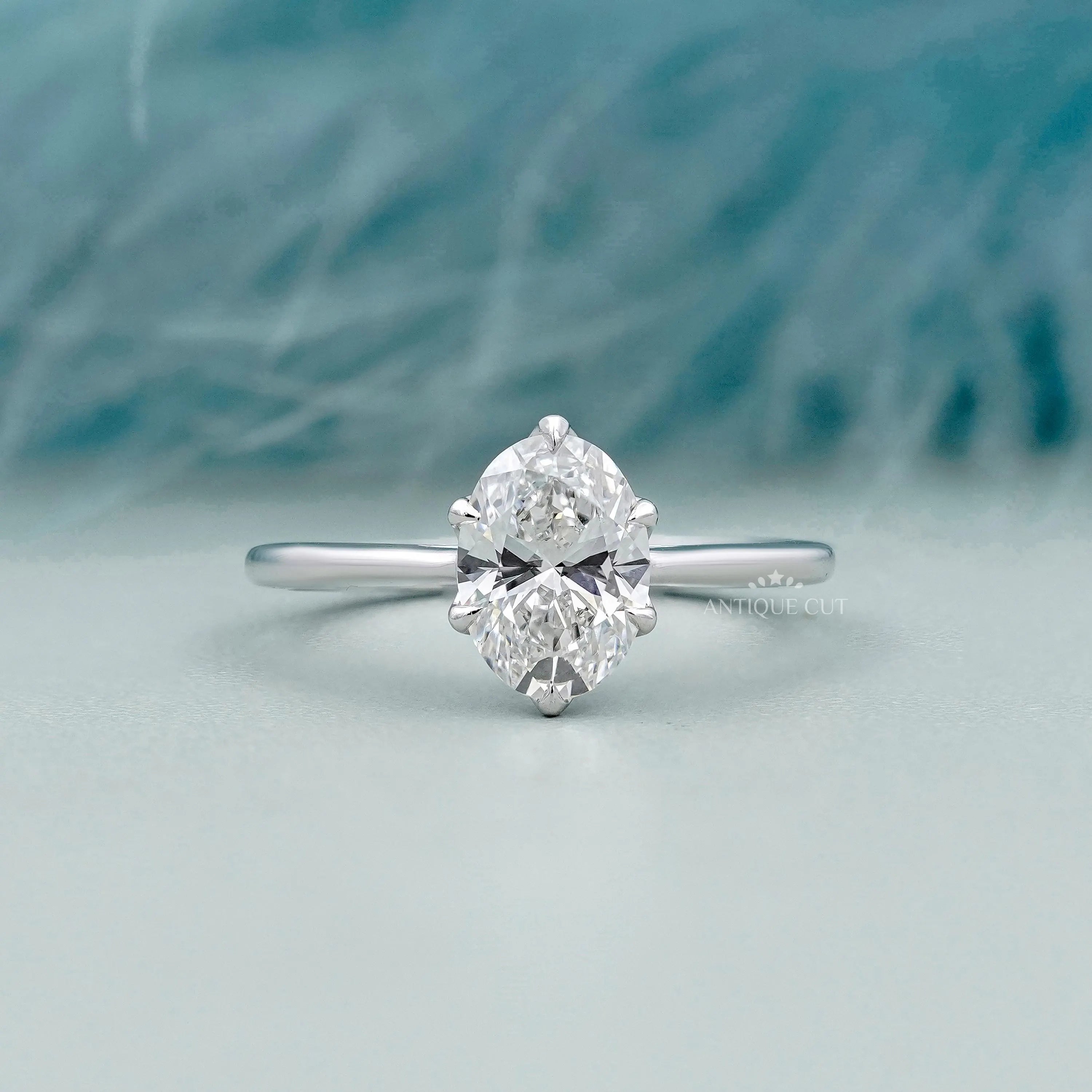 Oval solitaire engagement ring in white gold