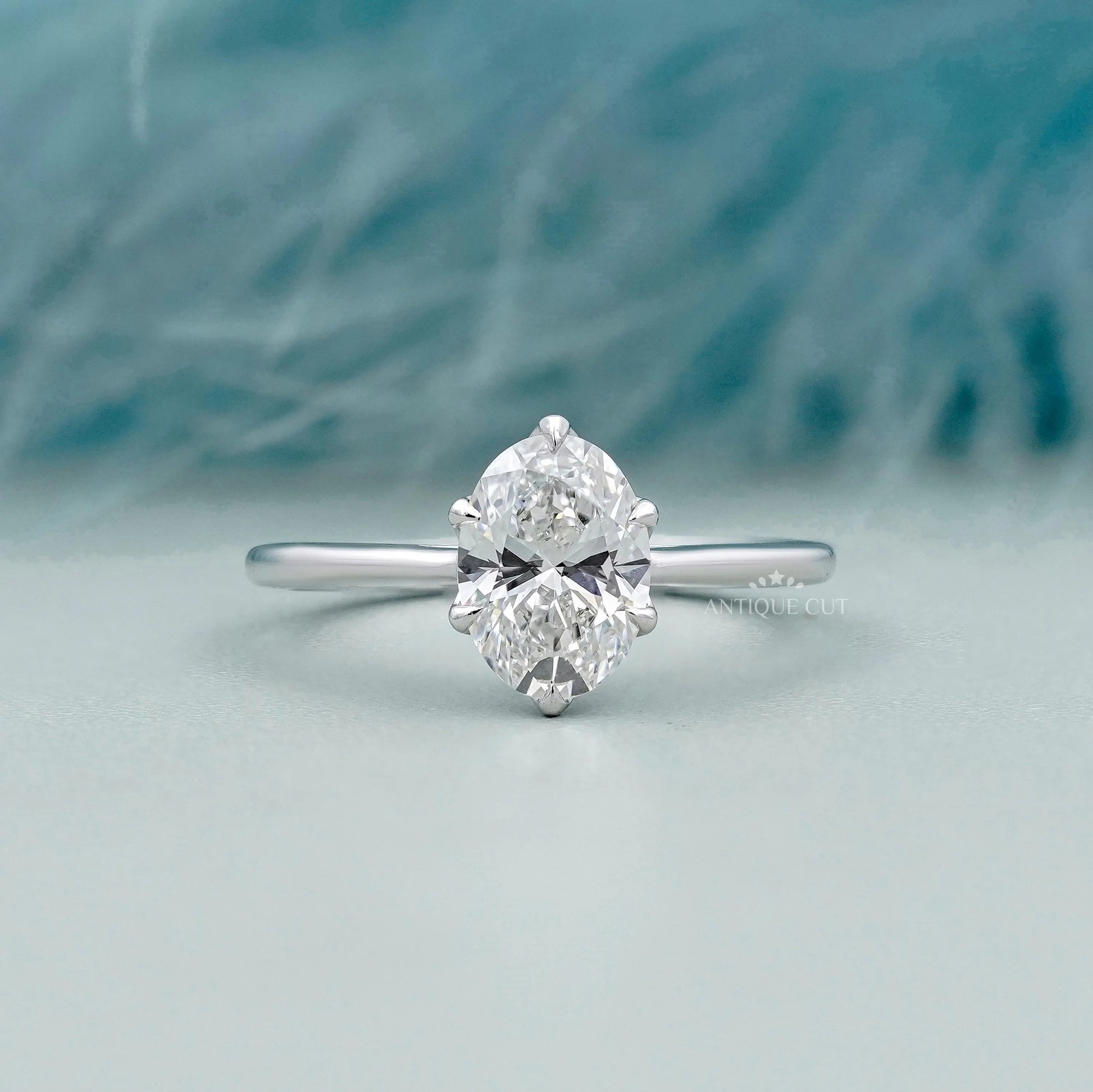 Oval solitaire engagement ring in white gold