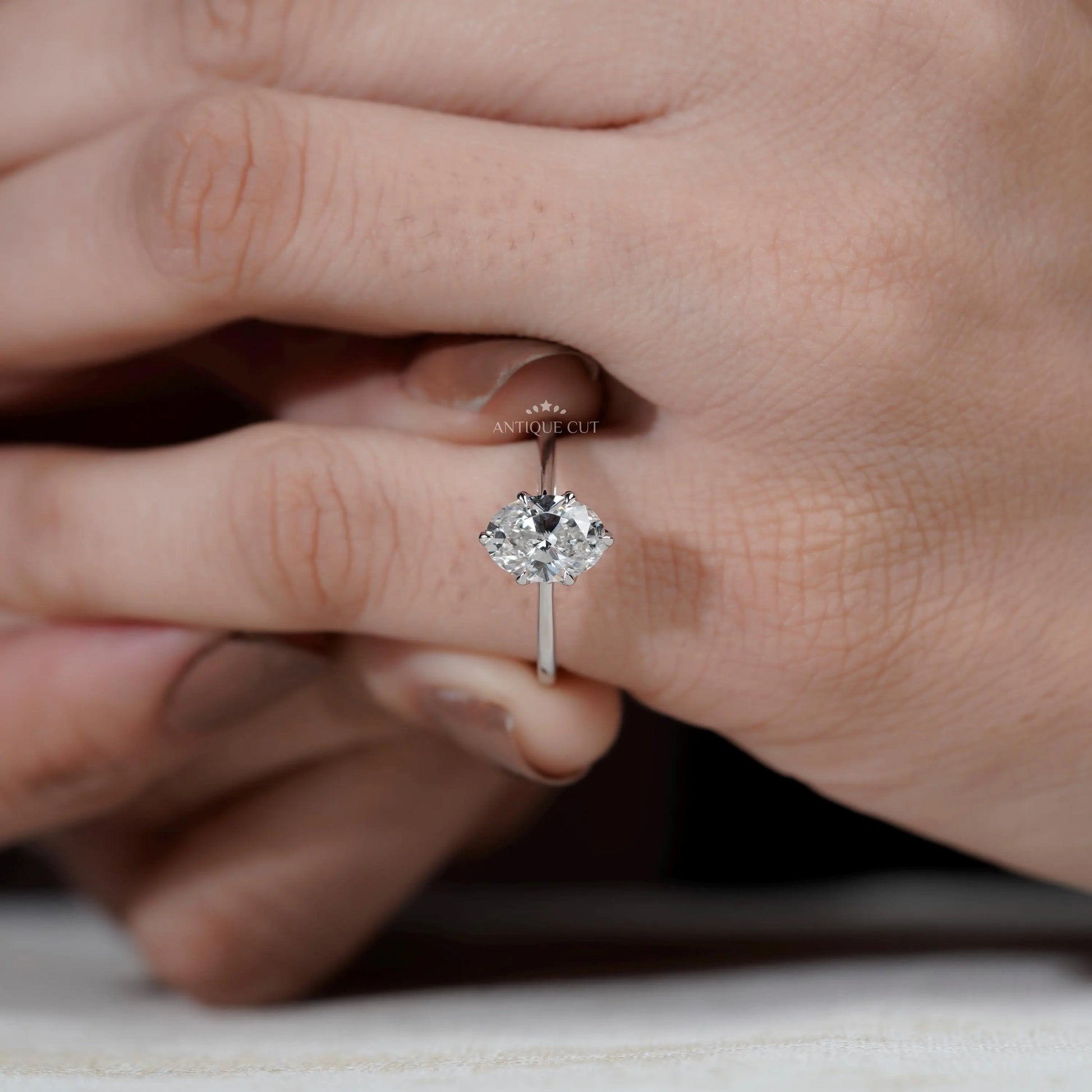 Oval diamond ring side view white gold