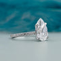 Lab grown pear shaped engagement ring with side stones