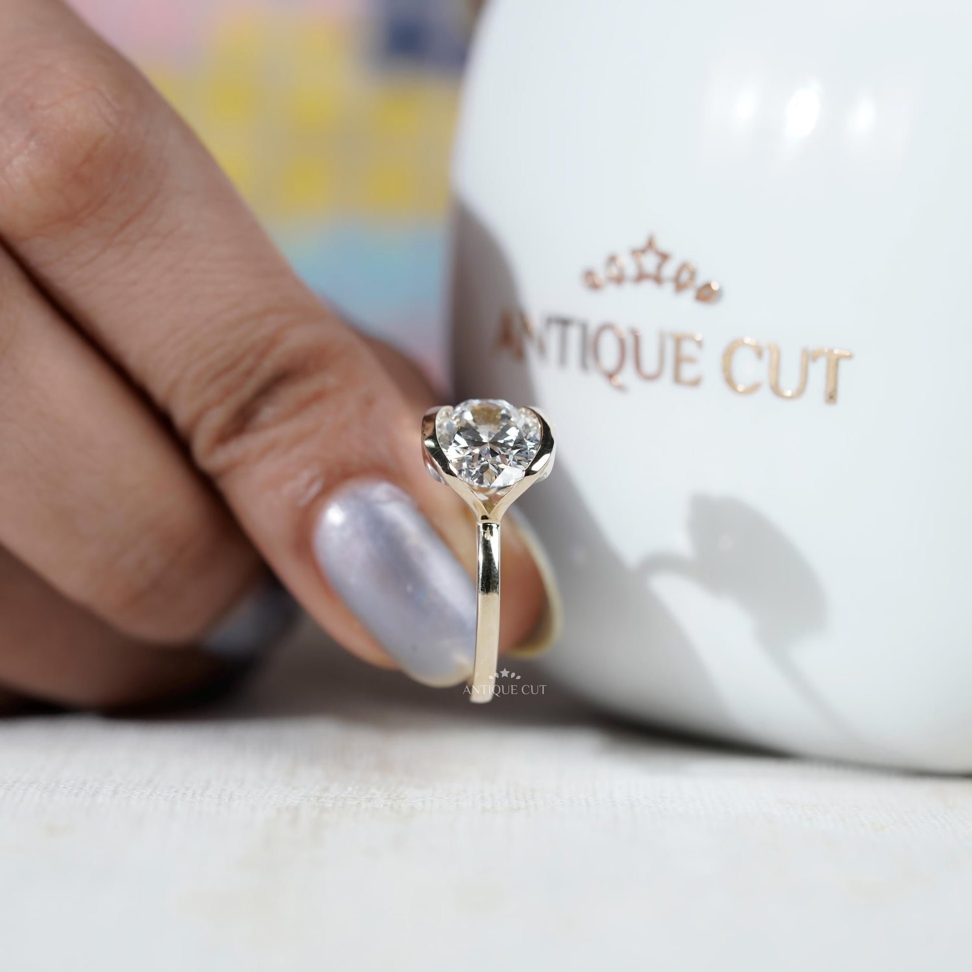 yellow gold east west oval solitaire ring