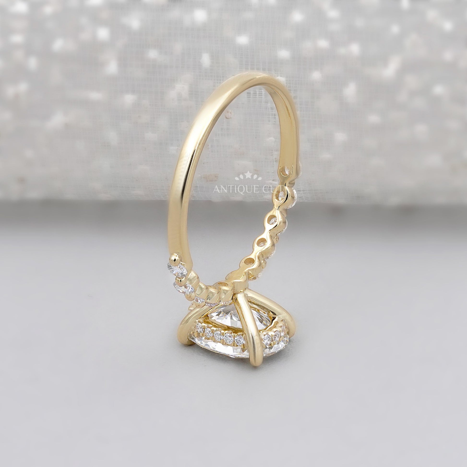 Antiquecut oval hidden halo engagement ring yellow gold