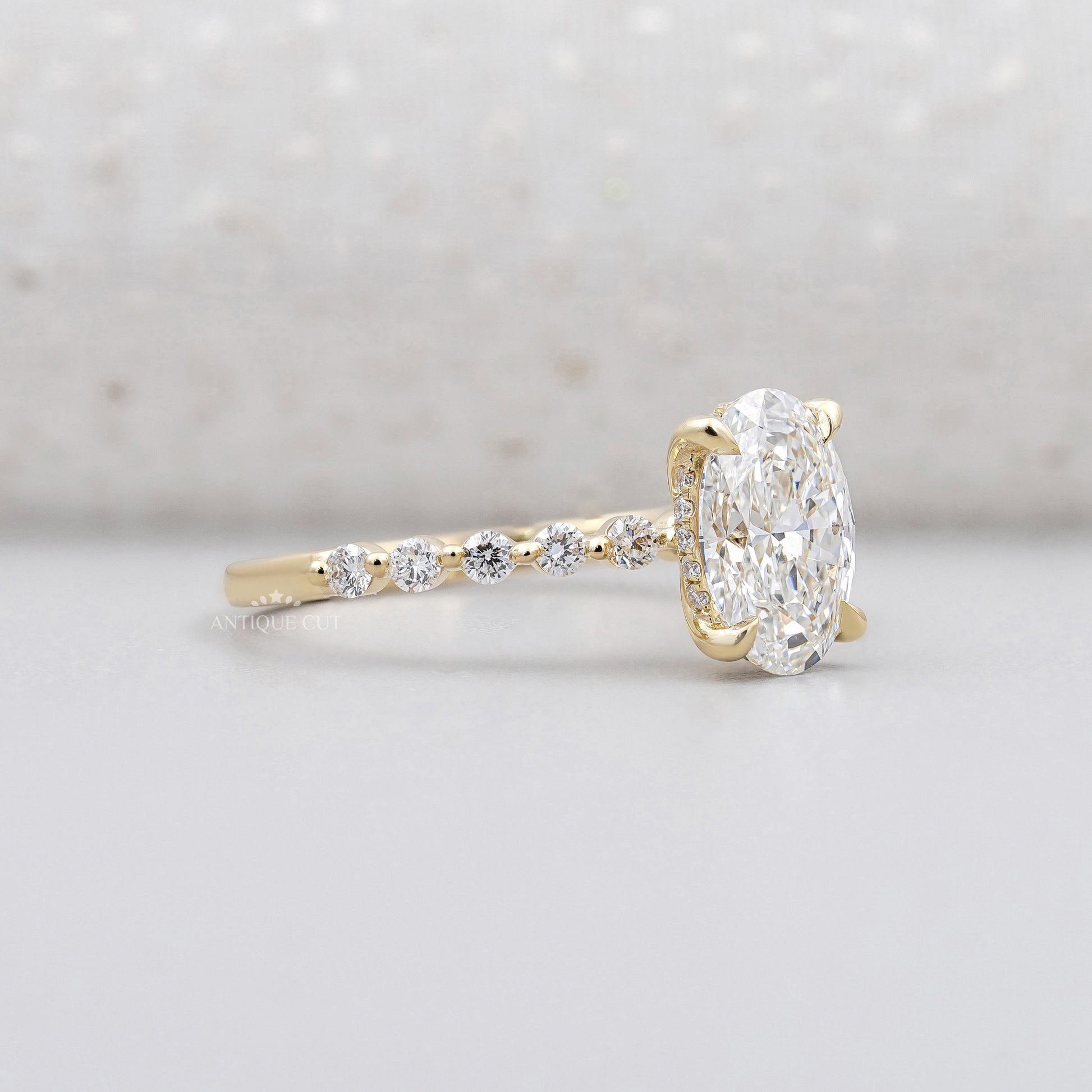 Lab grown oval hidden halo engagement ring