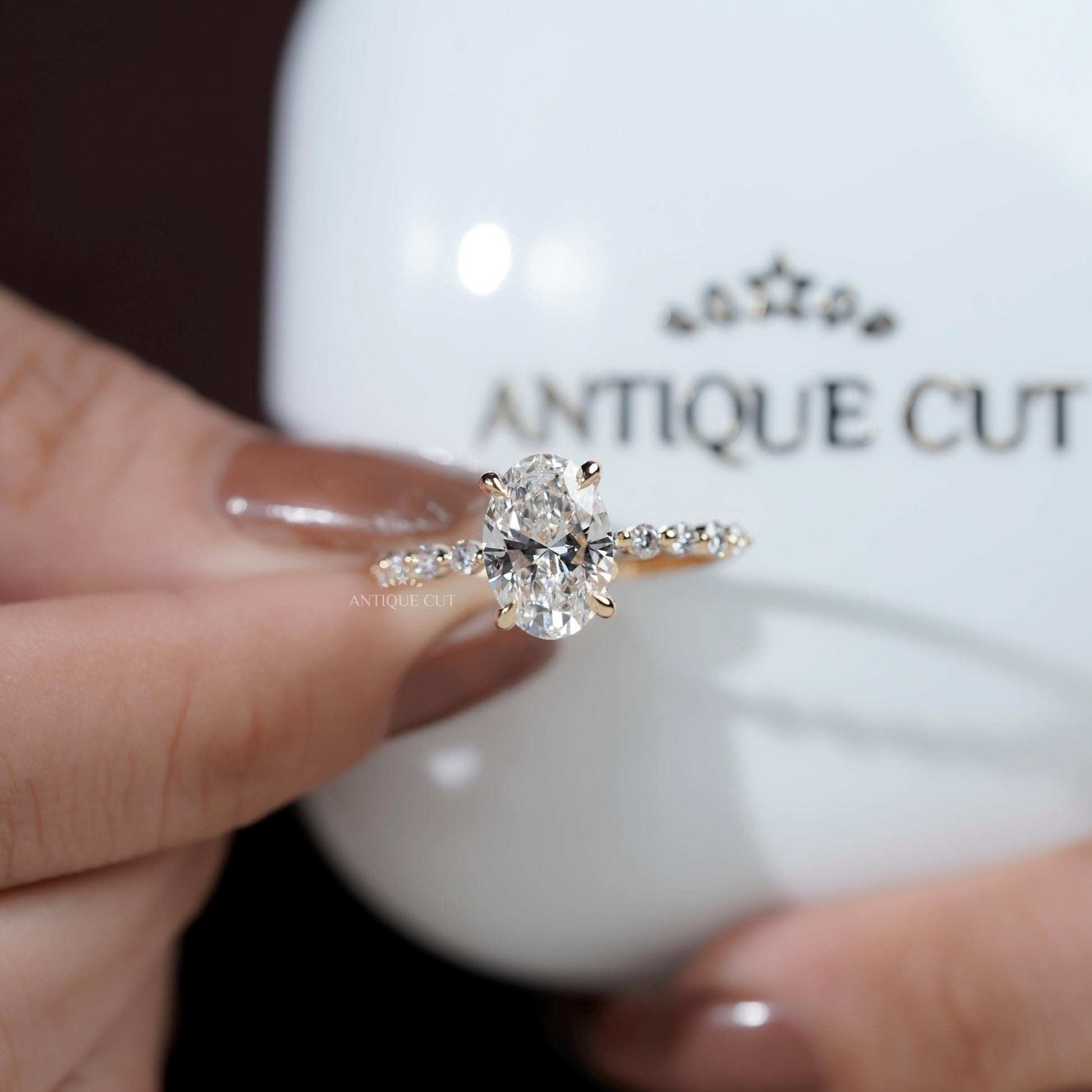 Brilliant oval cut engagement ring with hidden halo