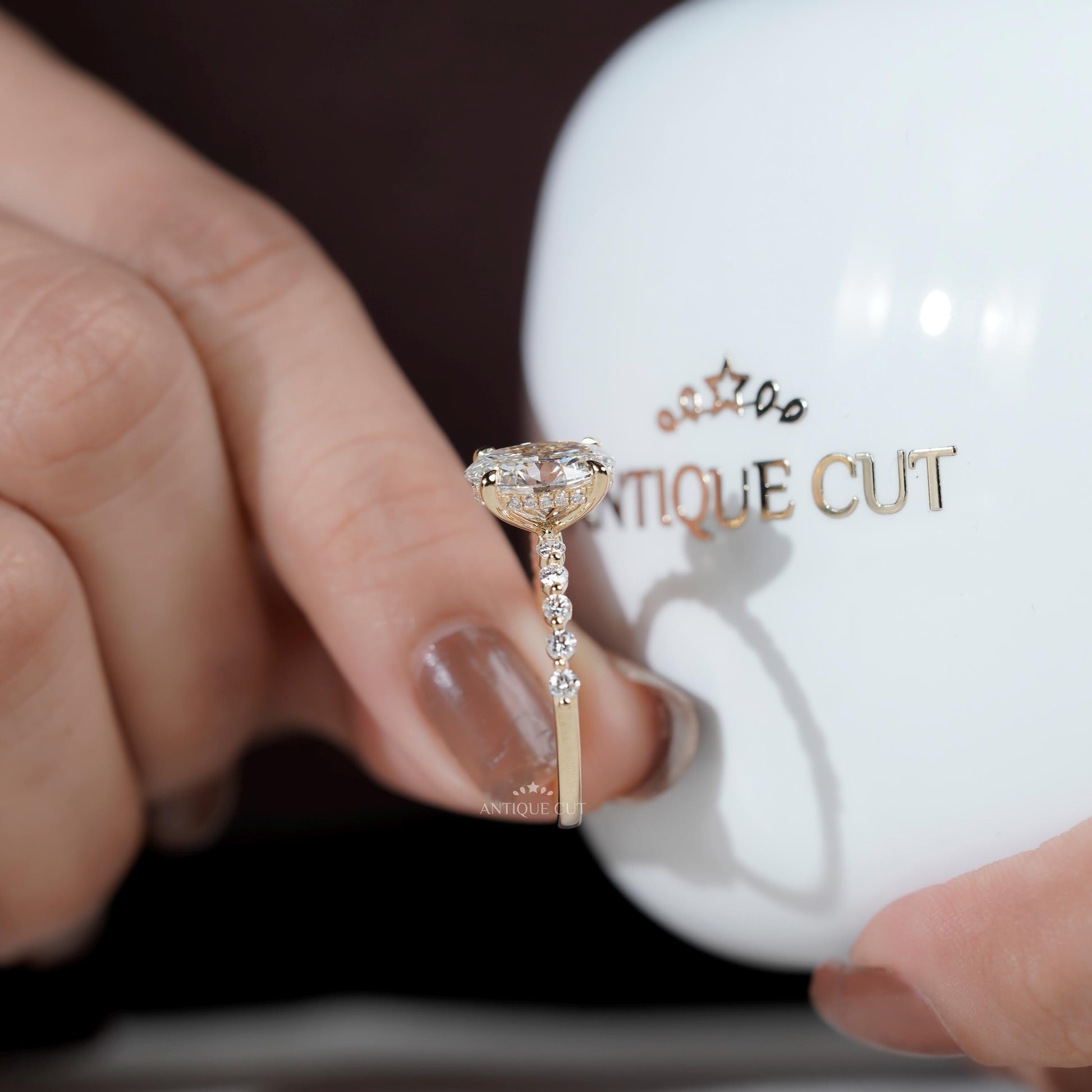 Yellow gold oval diamond ring top view pave band