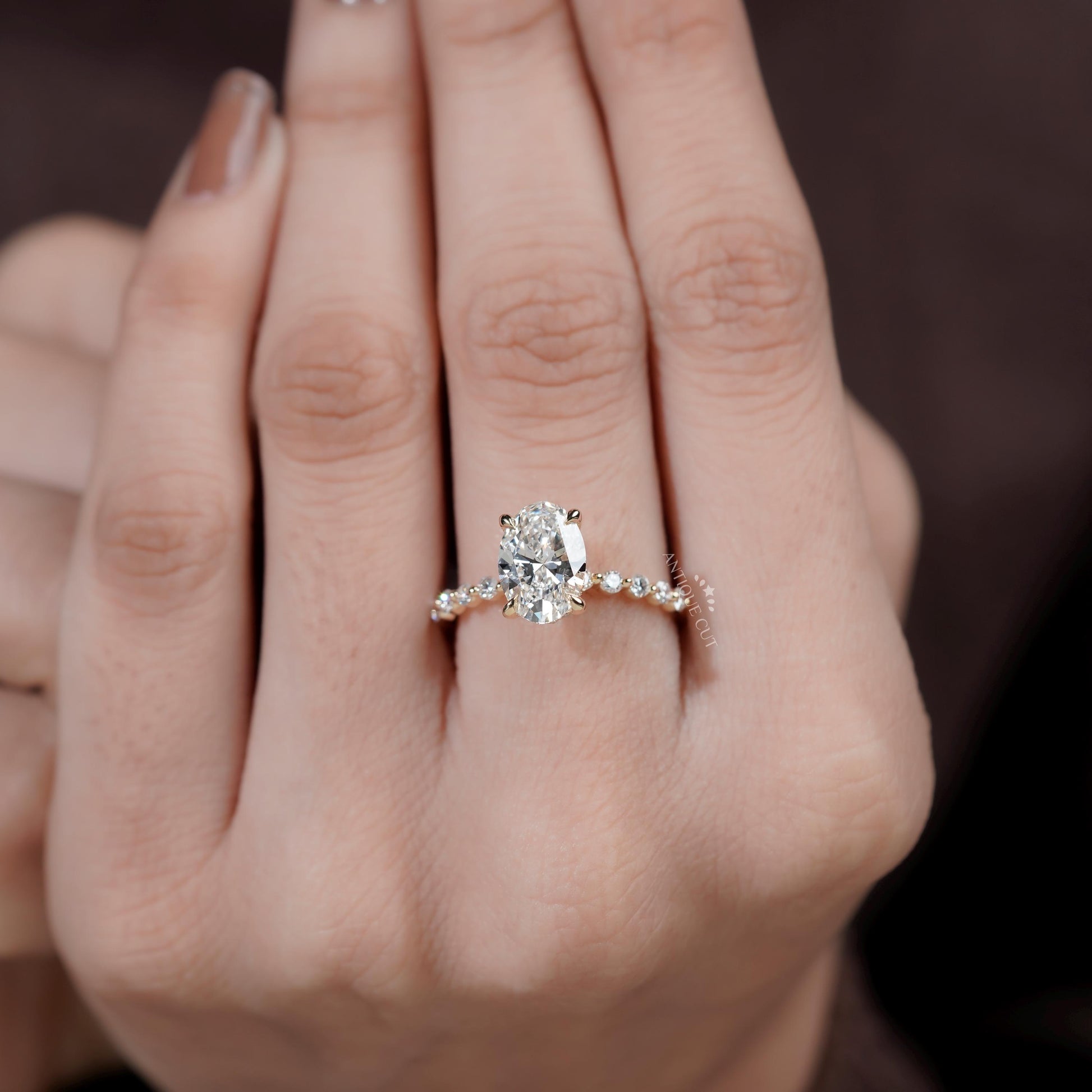 Luxury oval hidden halo engagement ring close-up