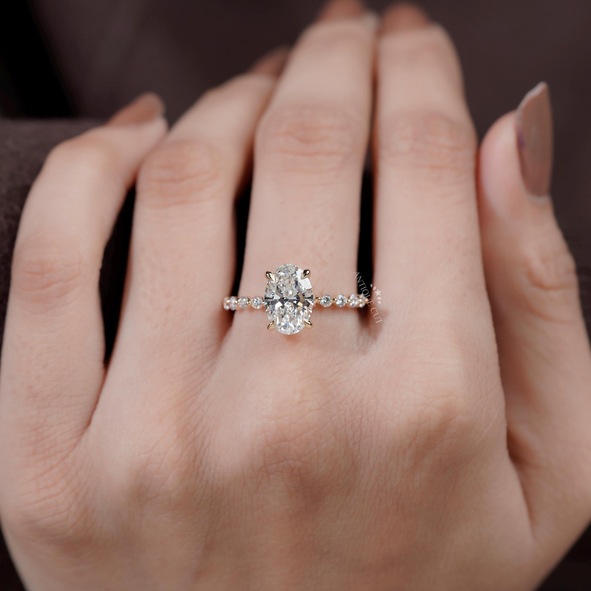 Oval diamond ring side view with hidden halo