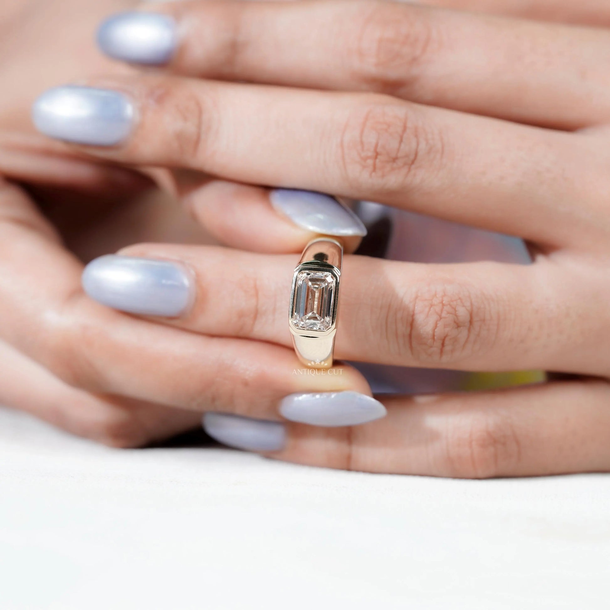 contemporary emerald cut diamond ring bezel