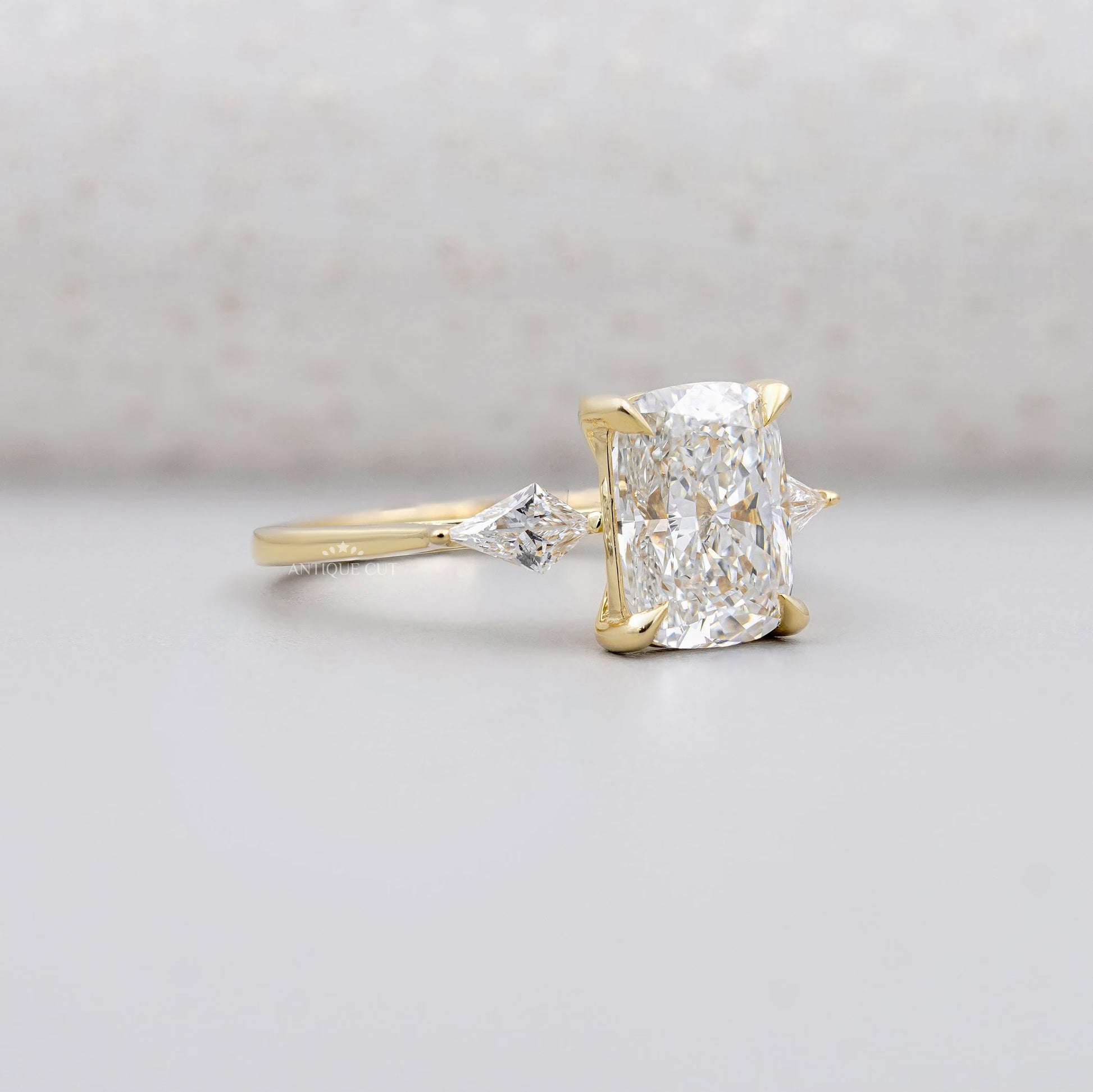 Cushion cut diamond engagement ring in yellow gold
