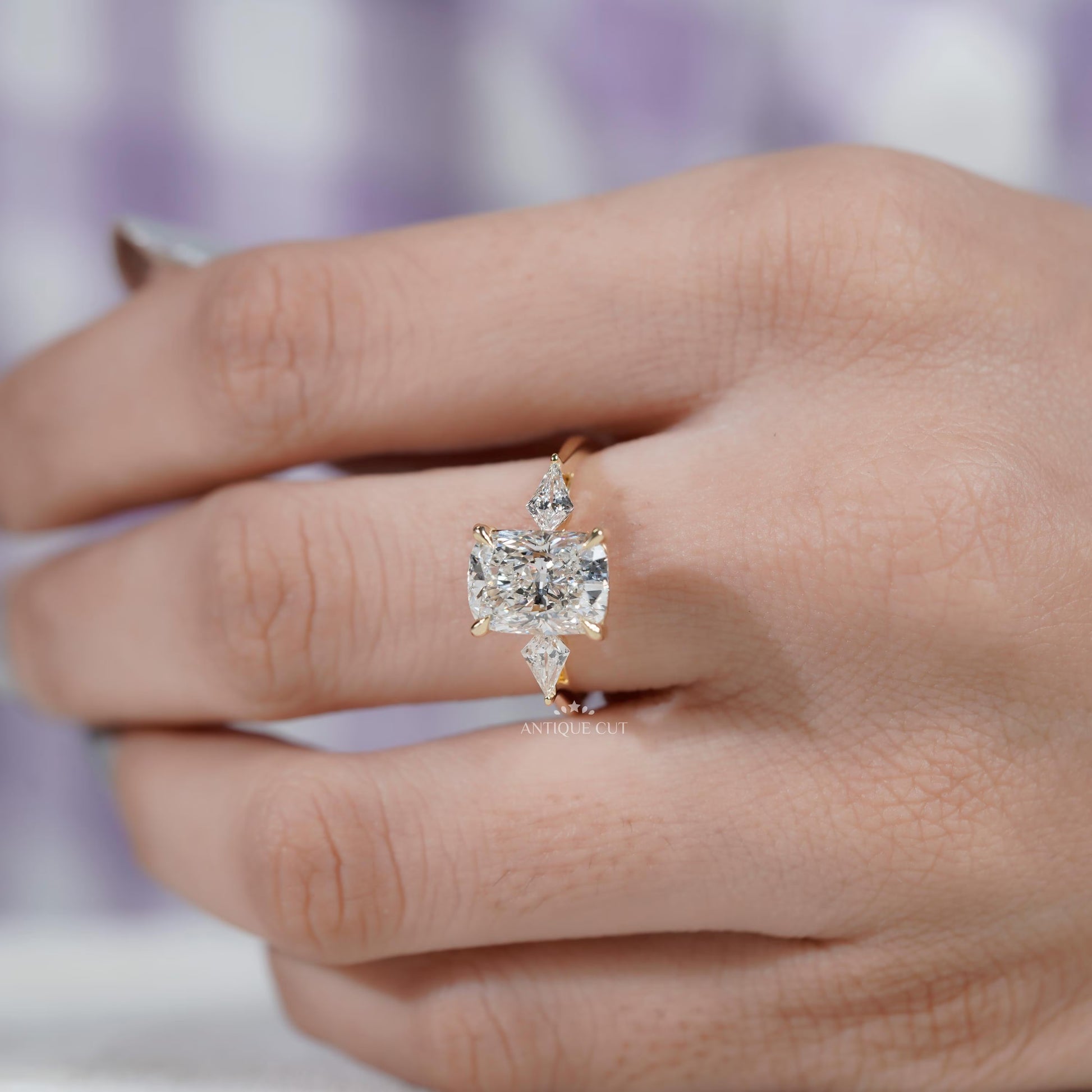 Cushion diamond ring side view with kite side stones