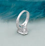 Oval diamond engagement ring sparkling under light