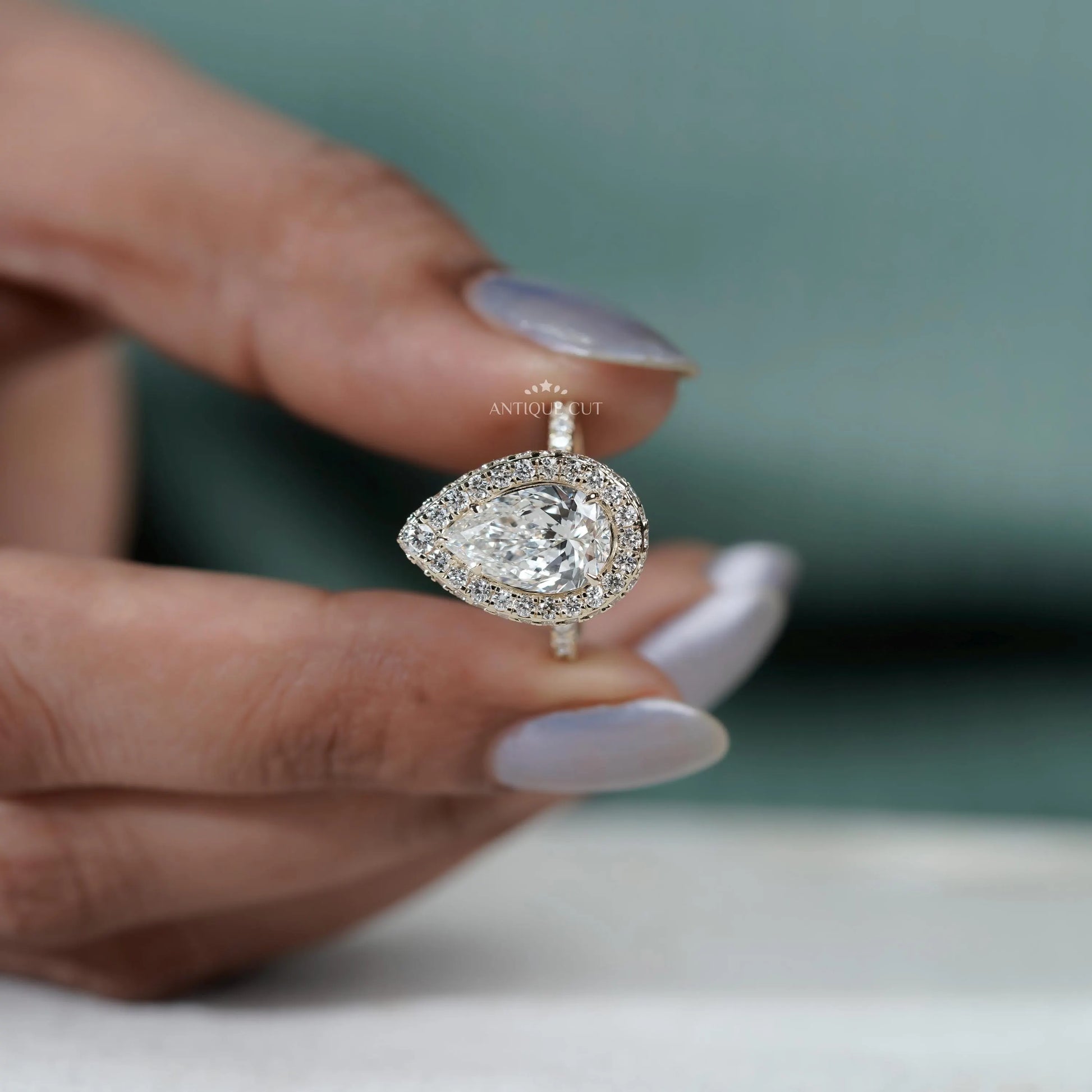 Pear shaped diamond ring top view halo