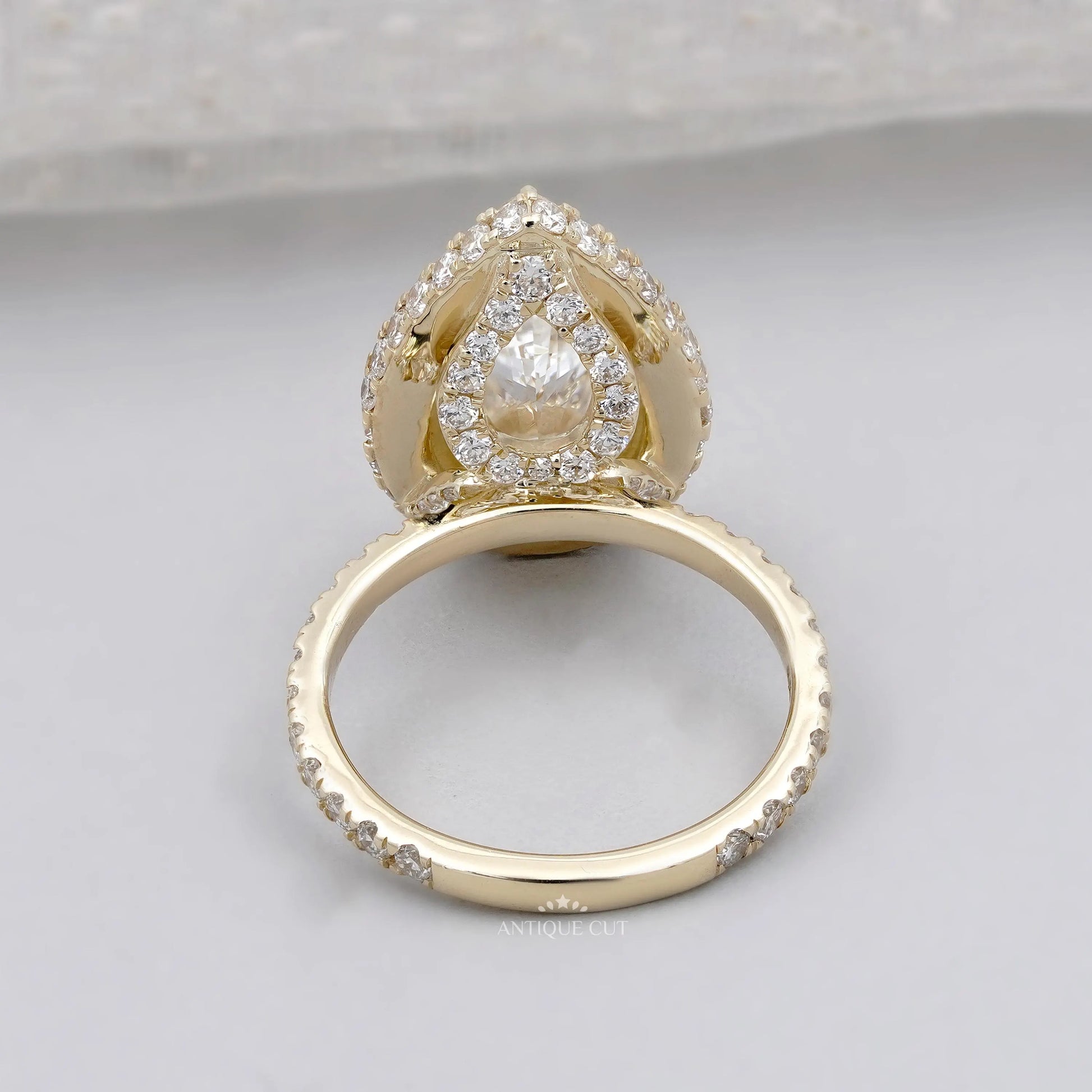 Hidden halo ring pear shape side view