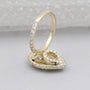 Pear cut diamond ring with sparkling halo