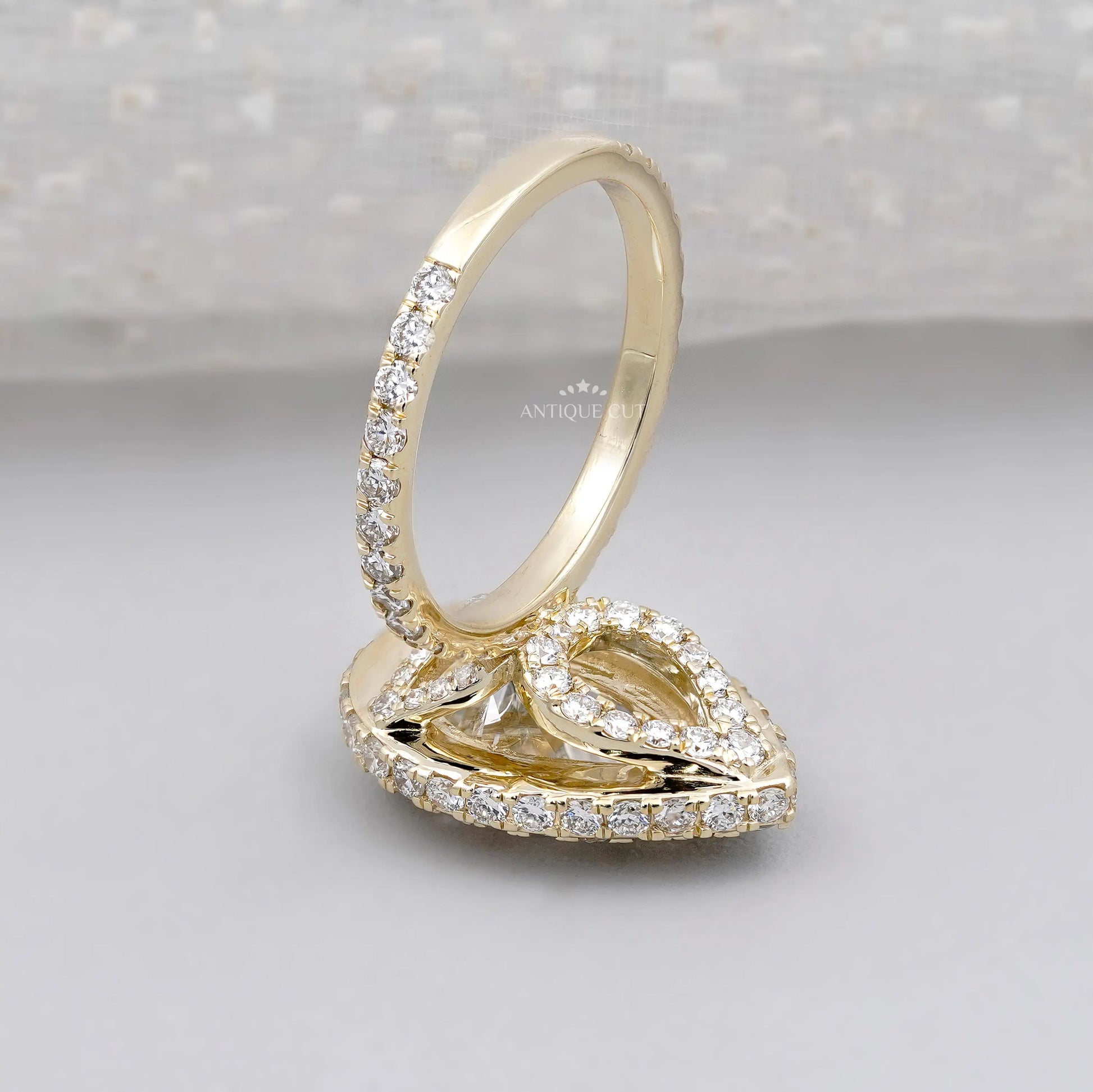 Pear cut diamond ring with sparkling halo