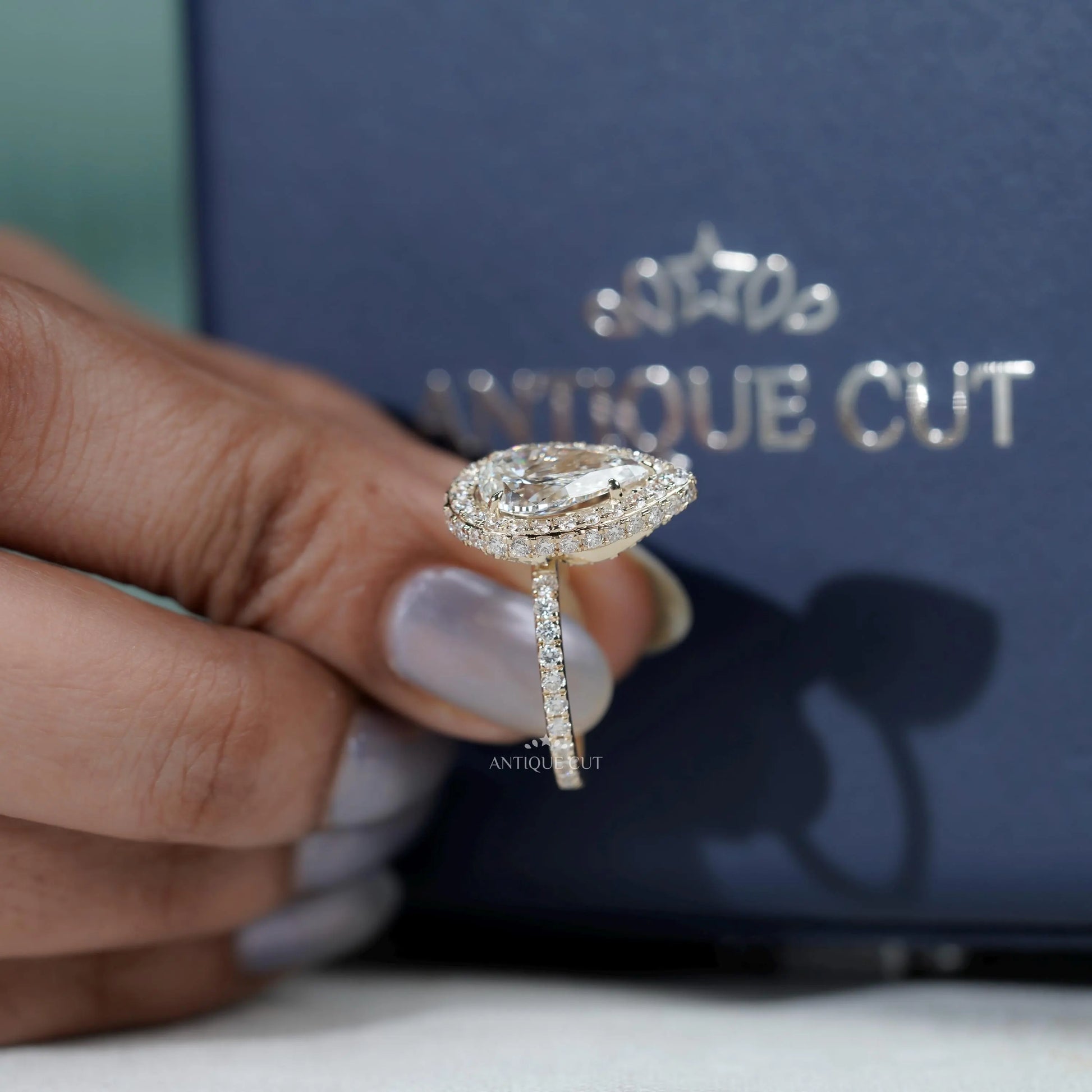 Elegant pear shape ring with hidden halo detail