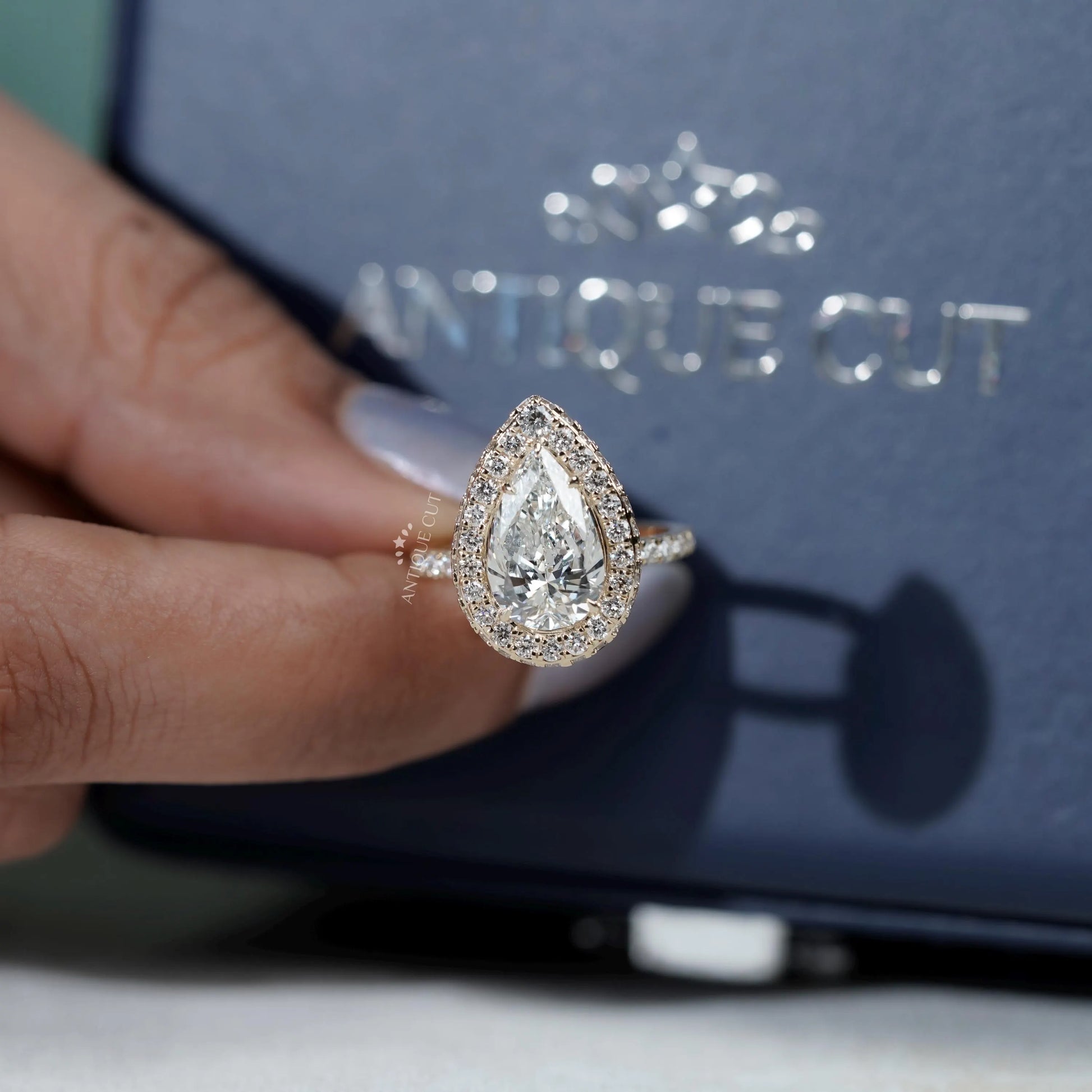 White gold halo engagement ring with pave diamonds