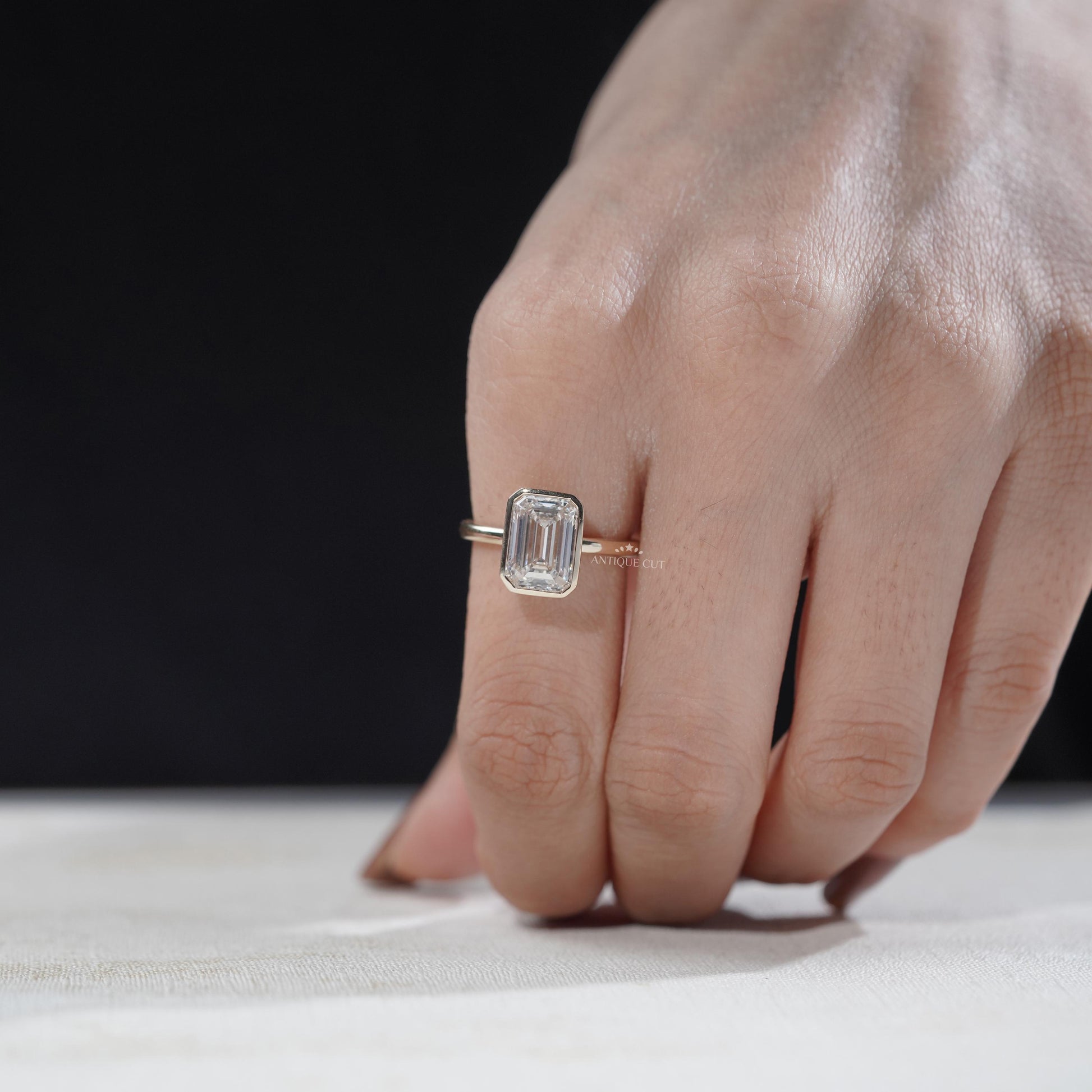Modern emerald engagement ring close-up