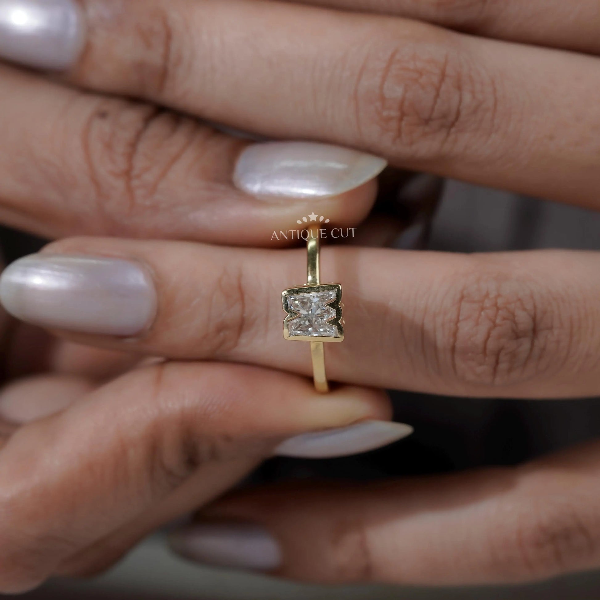 Yellow gold M shape diamond ring top view