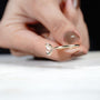 Oval diamond ring with subtle halo underneath