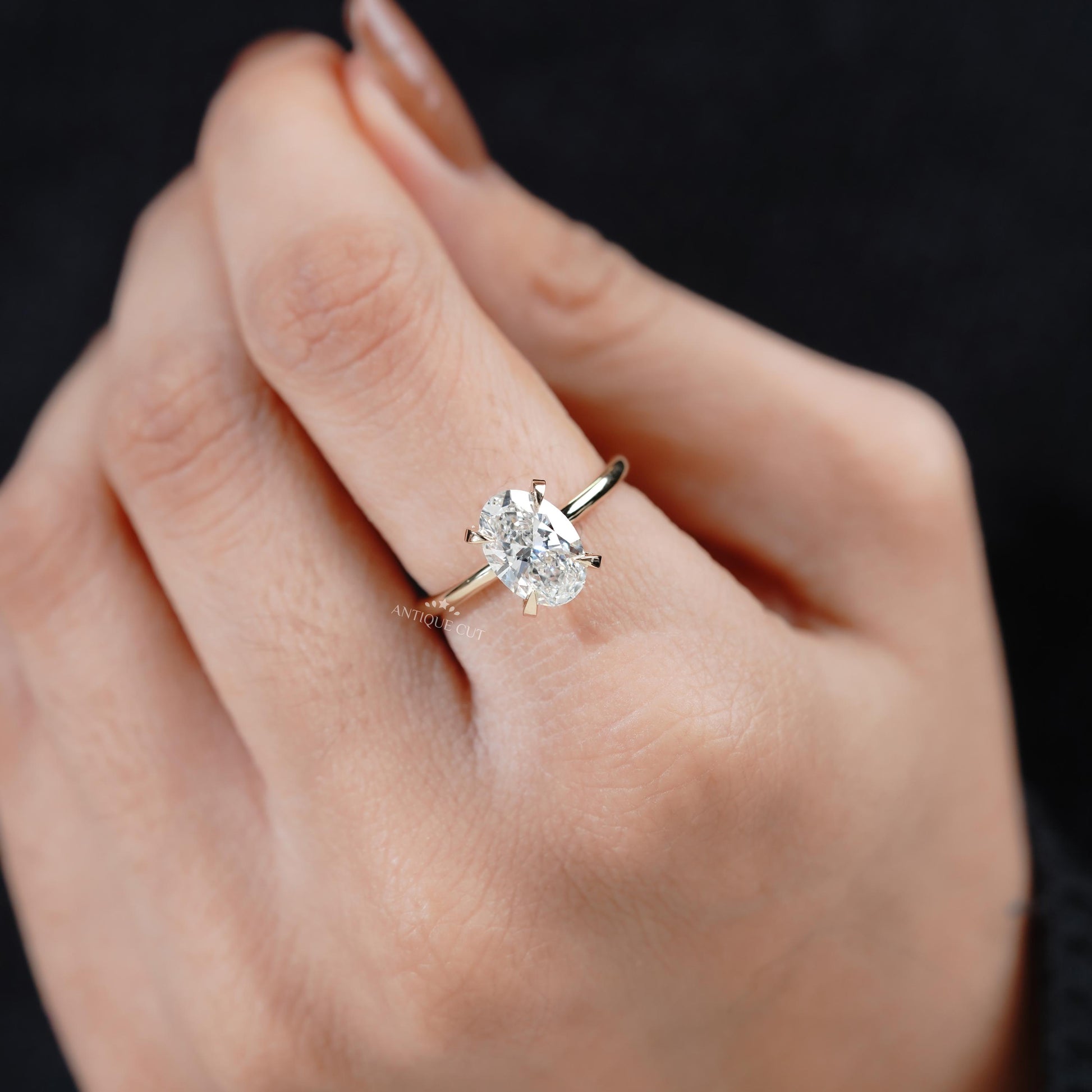 Yellow gold hidden halo oval ring top view